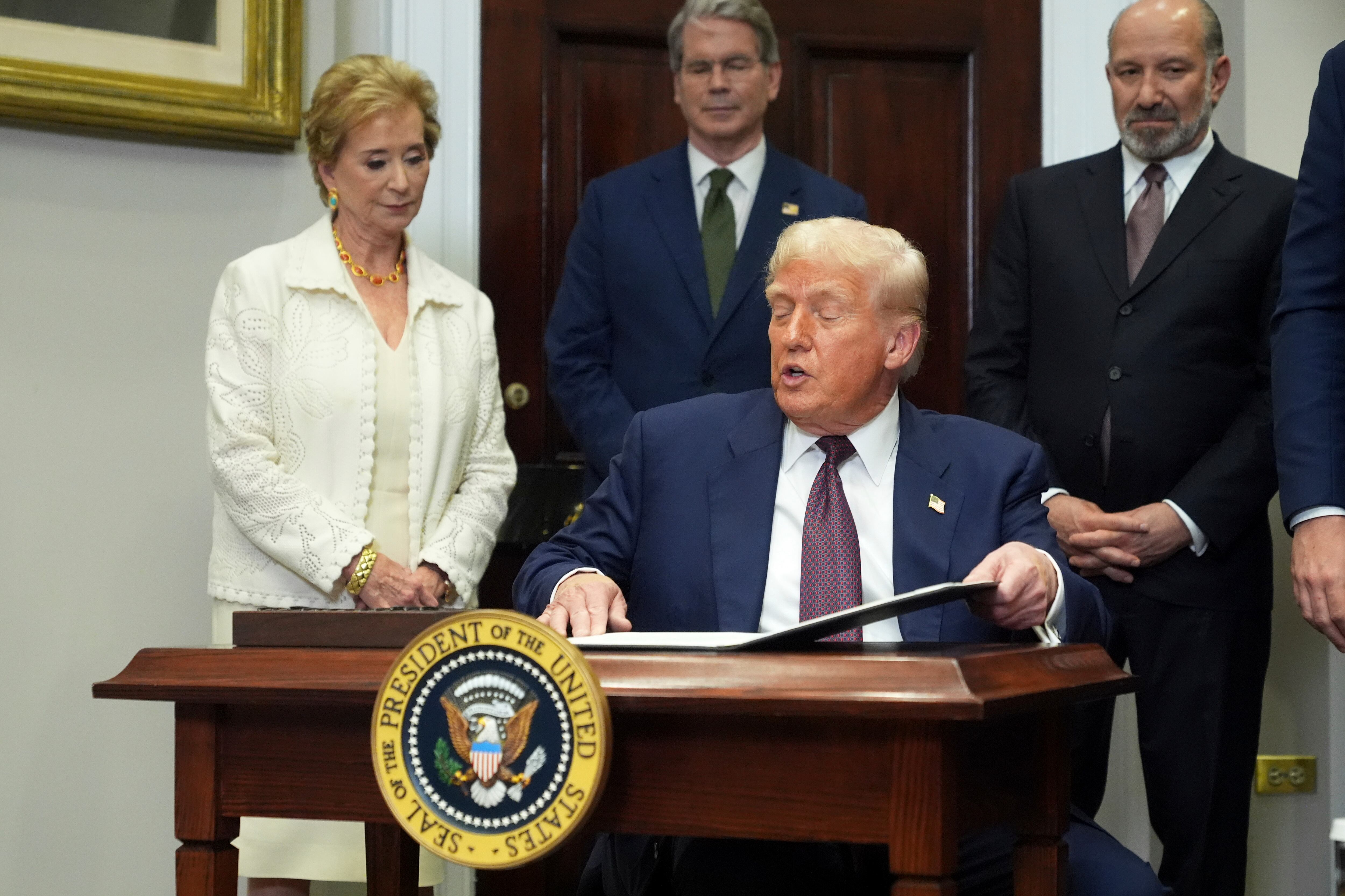 President Donald Trump signs an executive order July 31 to restart the Presidential Fitness Test. Tuesday, Trump's vow to shutter the Department of Education became a step closer to reality as programs were offloaded to other agencies.