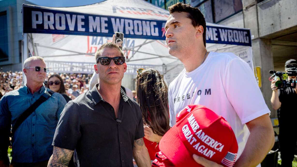 Charlie Kirk’s security guards stand by as Kirk hands out hats before he was fatally shot during Turning Point USA’s visit to Utah Valley University in Orem on Sept. 10. Brian Harpole on Tuesday described the moments following Kirk's assassination.