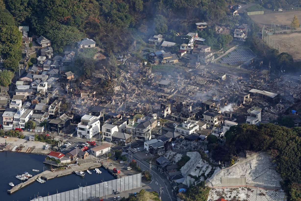 This shows the aftermath of a fire in Oita, southern Japan, Wednesday. Firefighters and army helicopters battled the fire that burned through a neighborhood of old wooden houses in a fishing town.
