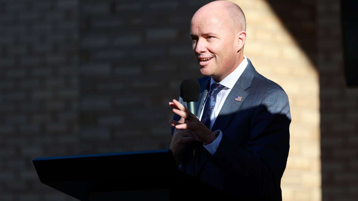 Gov. Spencer Cox speaks at a ribbon-cutting event at Arbor 515, a new affordable housing project, in Salt Lake City on Oct. 30. Cox's popularity is holding strong with Republicans but dipping among Democrats, according to a new poll.