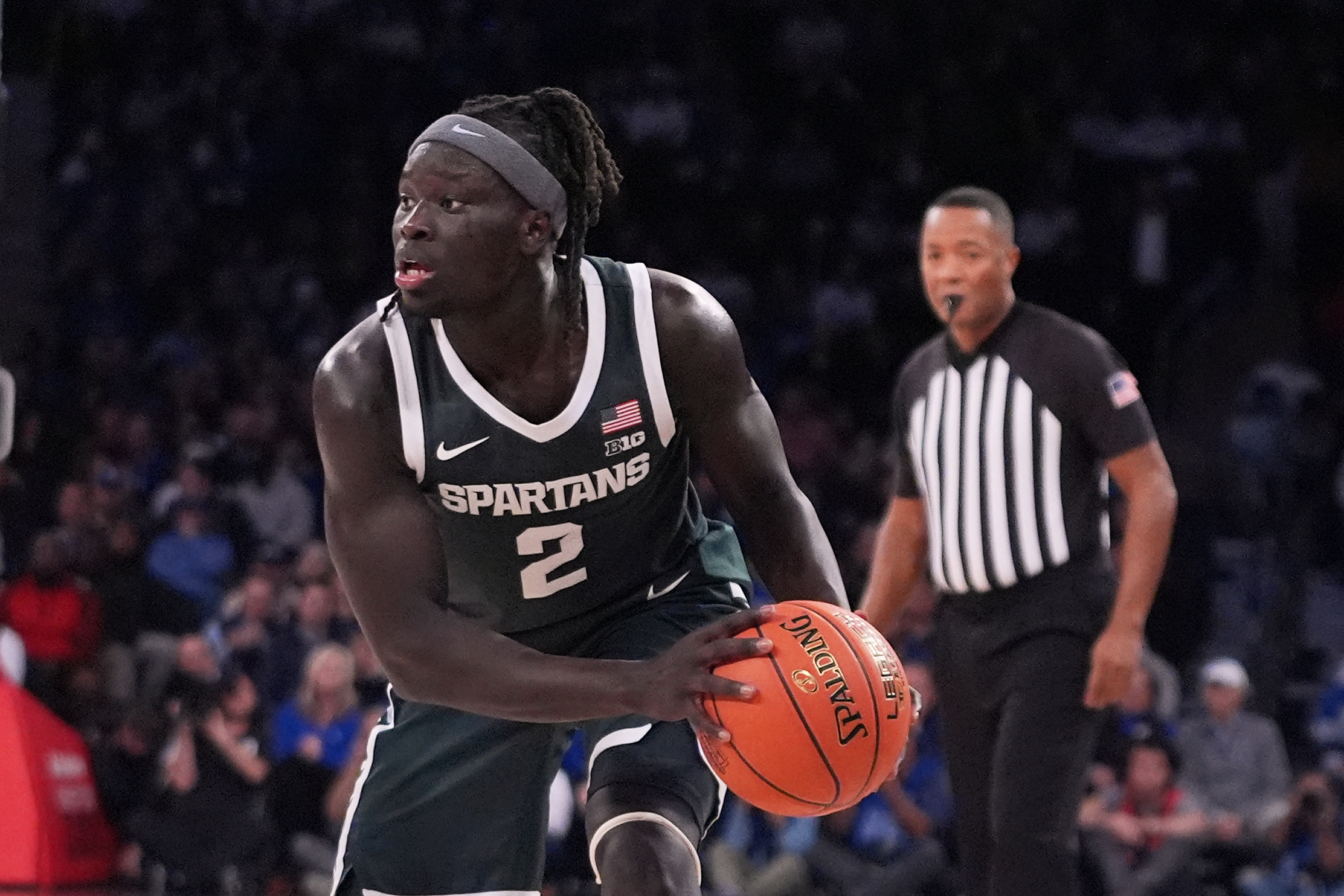 Michigan State's Kur Teng (2) looks to pass during the second half of an NCAA college basketball game against Kentucky Tuesday, Nov. 18, 2025, in New York.
