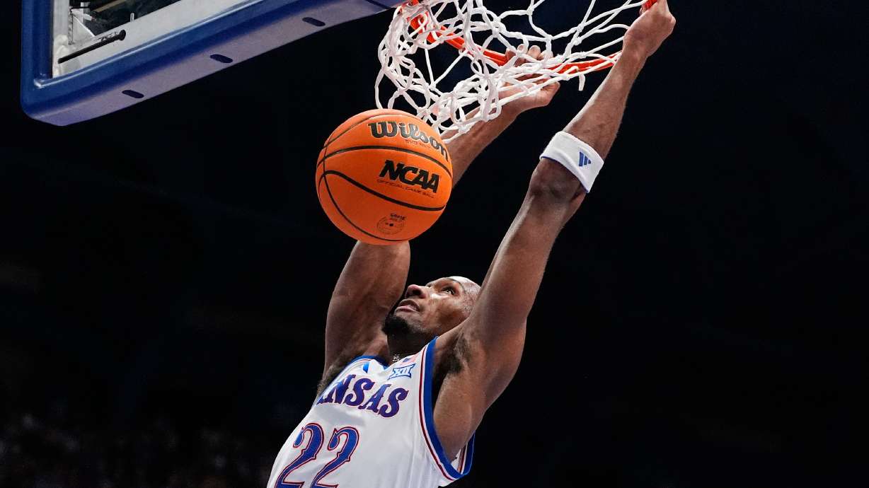 Kansas guard Darryn Peterson dunks the ball during the first half of an NCAA college basketball game against Green Bay, Monday, Nov. 3, 2025, in Lawrence, Kan.