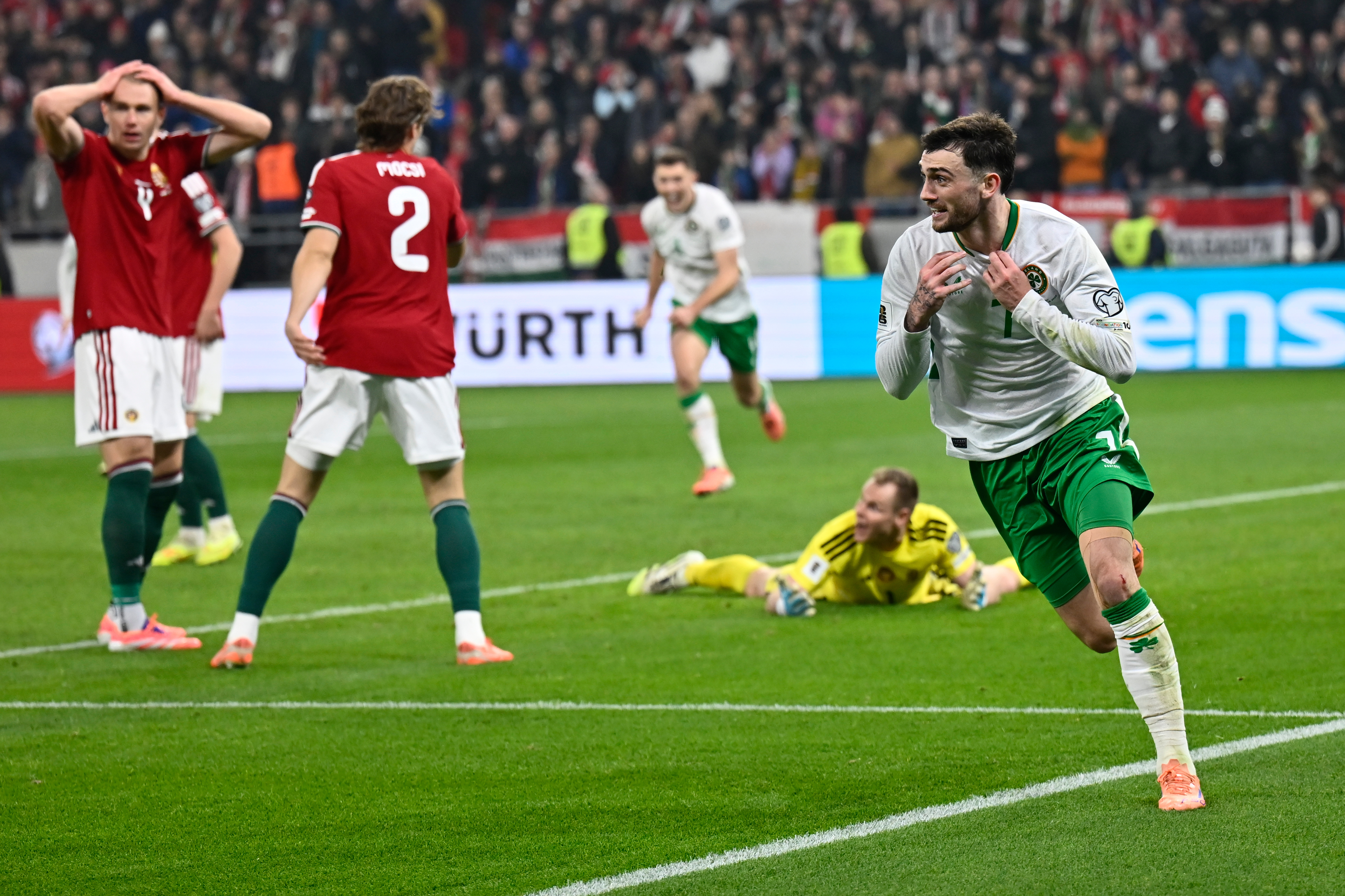 Ireland's Troy Parrott, right, celebrates after scoring his side's third goal during the World Cup 2026 group F qualifying soccer match between Hungary and Ireland in Budapest, Hungary, Sunday, Nov. 16, 2025. 