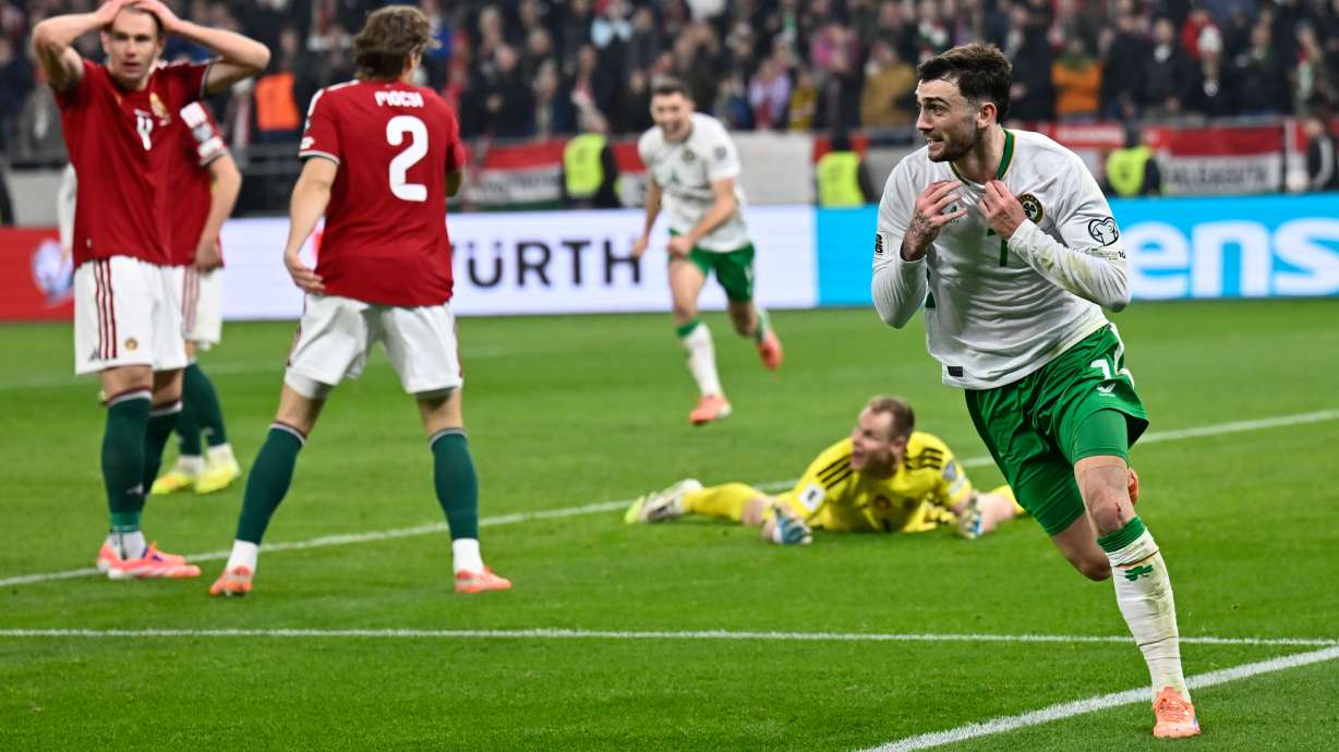 Ireland's Troy Parrott, right, celebrates after scoring his side's third goal during the World Cup 2026 group F qualifying soccer match between Hungary and Ireland in Budapest, Hungary, Sunday, Nov. 16, 2025.