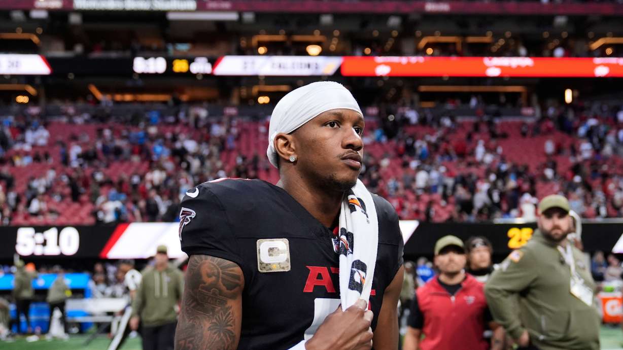 Atlanta Falcons quarterback Michael Penix Jr. (9) walks of the field after overtime of an NFL football game against the Carolina Panthers, Sunday, Nov. 16, 2025, in Atlanta.