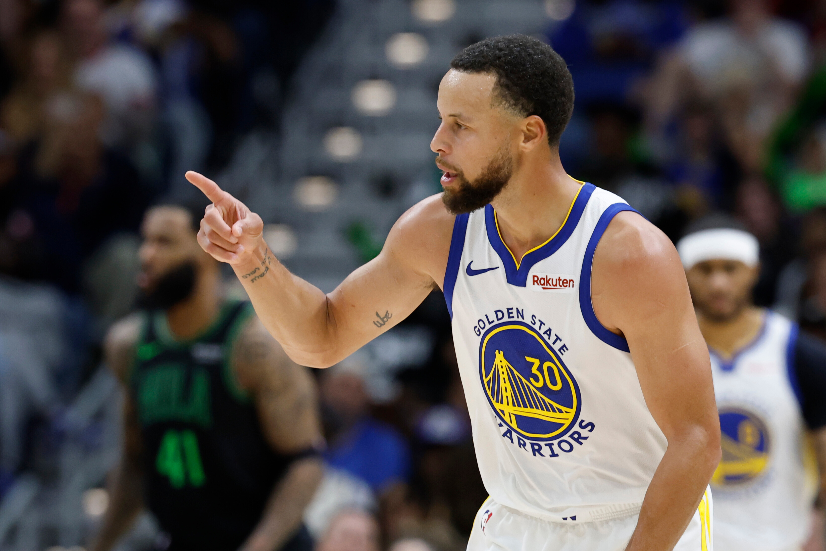 Golden State Warriors guard Stephen Curry reacts to a three-point basket against the New Orleans Pelicans during the third quarter of an NBA basketball game, Sunday, Nov. 16, 2025, in New Orleans. 