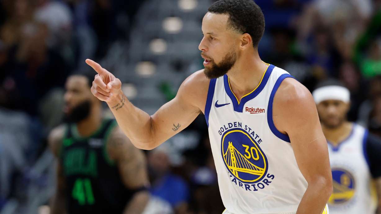 Golden State Warriors guard Stephen Curry reacts to a three-point basket against the New Orleans Pelicans during the third quarter of an NBA basketball game, Sunday, Nov. 16, 2025, in New Orleans.