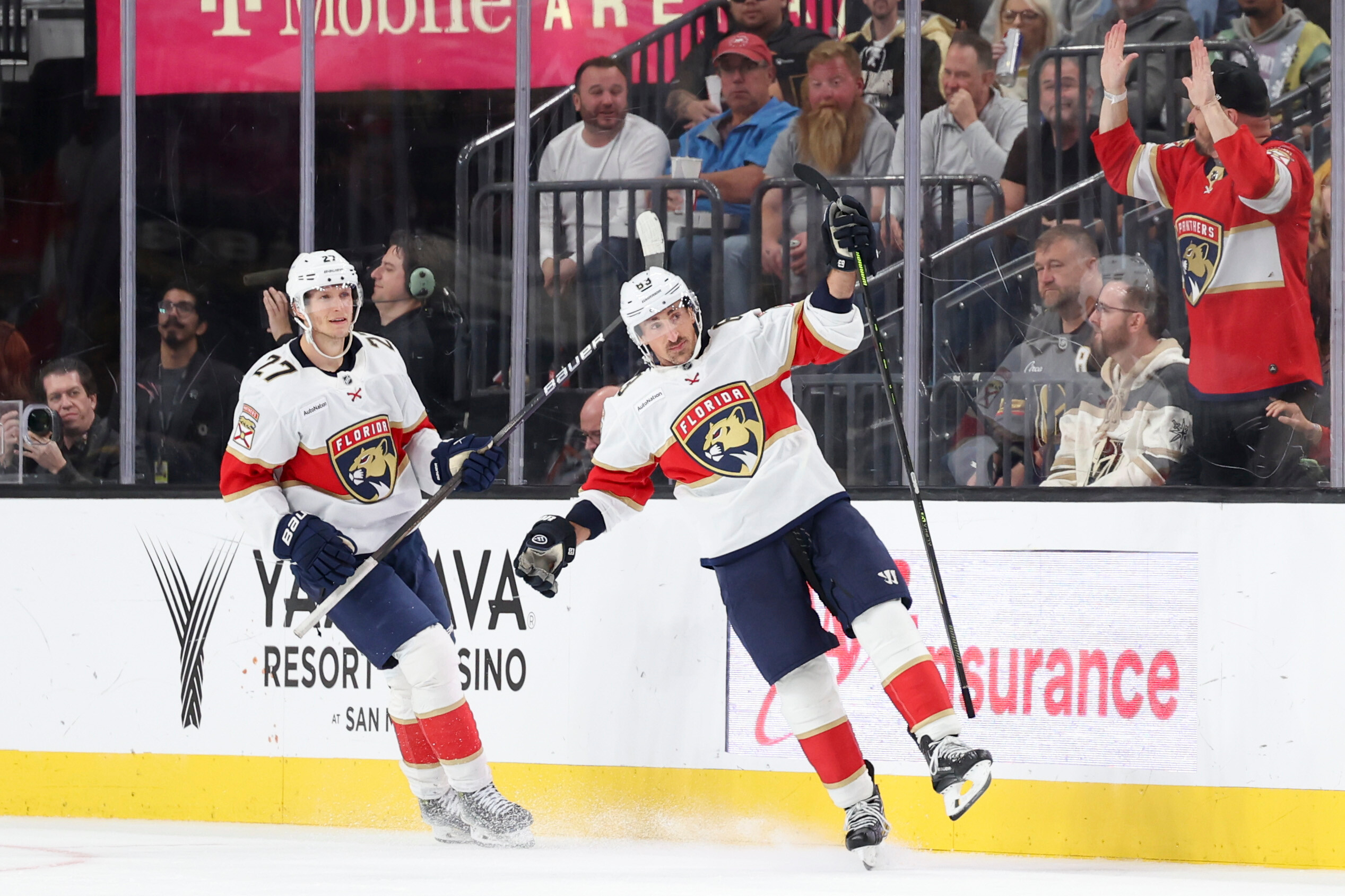 Florida Panthers center Eetu Luostarinen (27) and left wing Brad Marchand (63) celebrate after Marchand's goal against the Vegas Golden Knights during the second period of an NHL hockey game Monday, Nov. 10, 2025, in Las Vegas.