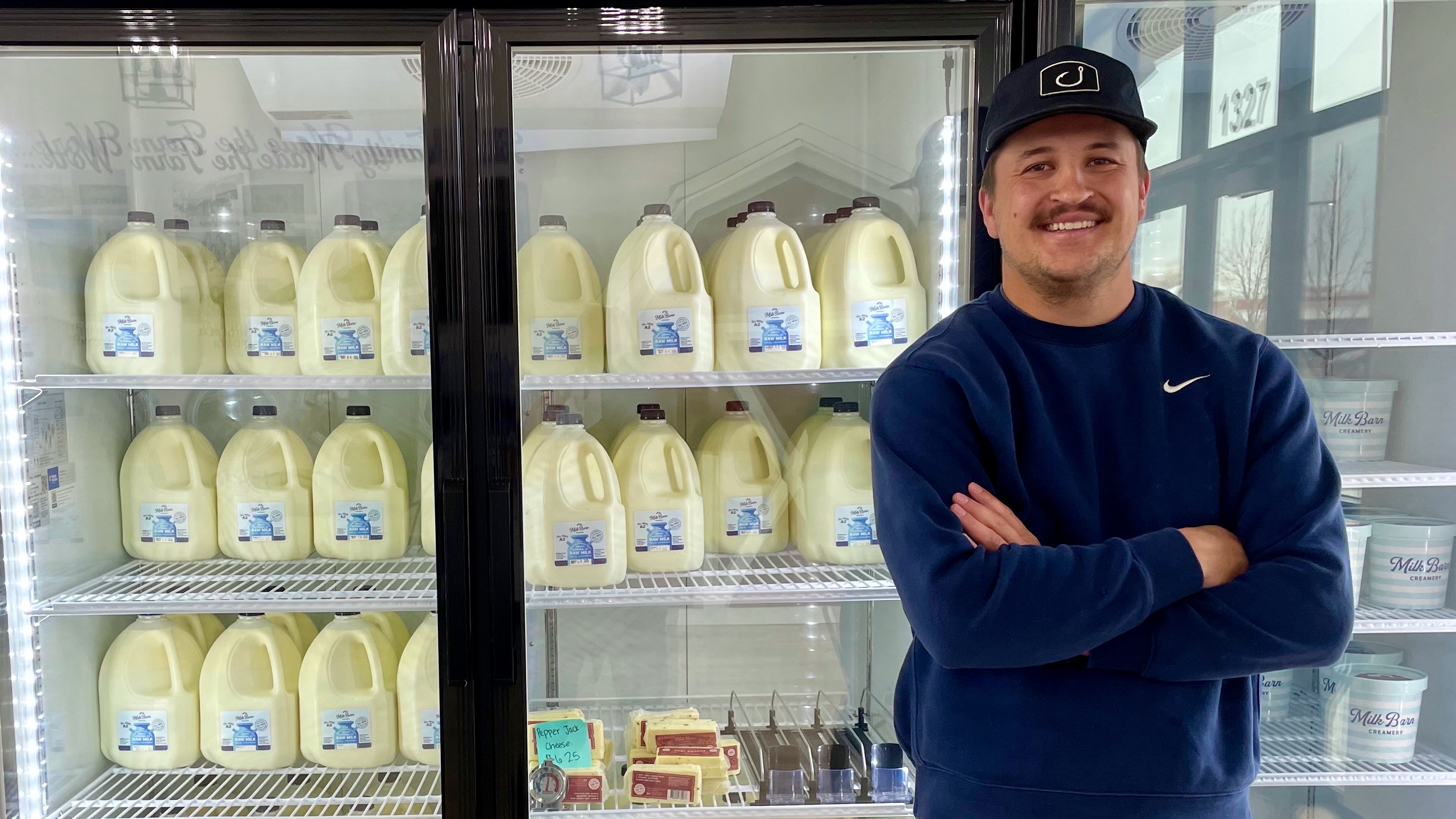 A new store in Ogden that sells raw milk, Milk Barn Creamery, faced a graffiti attack. One of the stores owners, Trevor Rose, poses inside the locale on Wednesday.