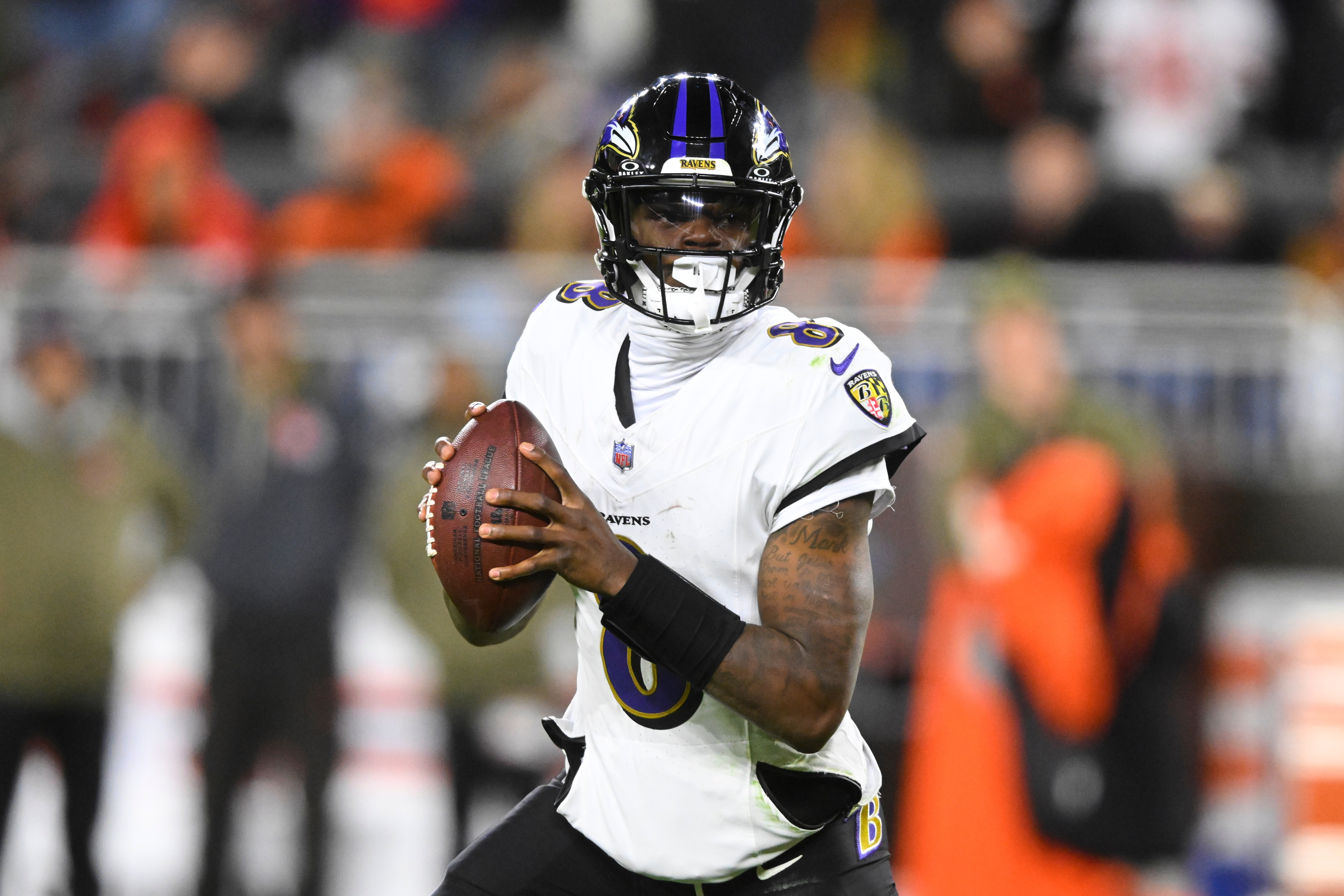 Baltimore Ravens quarterback Lamar Jackson (8) rolls out of the pocket in the second half of an NFL football game against the Cleveland Browns in Cleveland, Sunday, Nov. 16, 2025. 