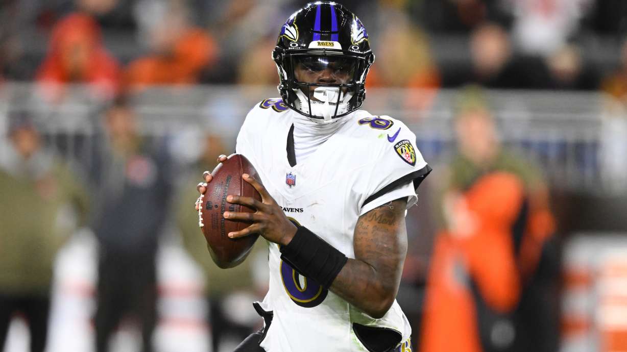 Baltimore Ravens quarterback Lamar Jackson (8) rolls out of the pocket in the second half of an NFL football game against the Cleveland Browns in Cleveland, Sunday, Nov. 16, 2025.