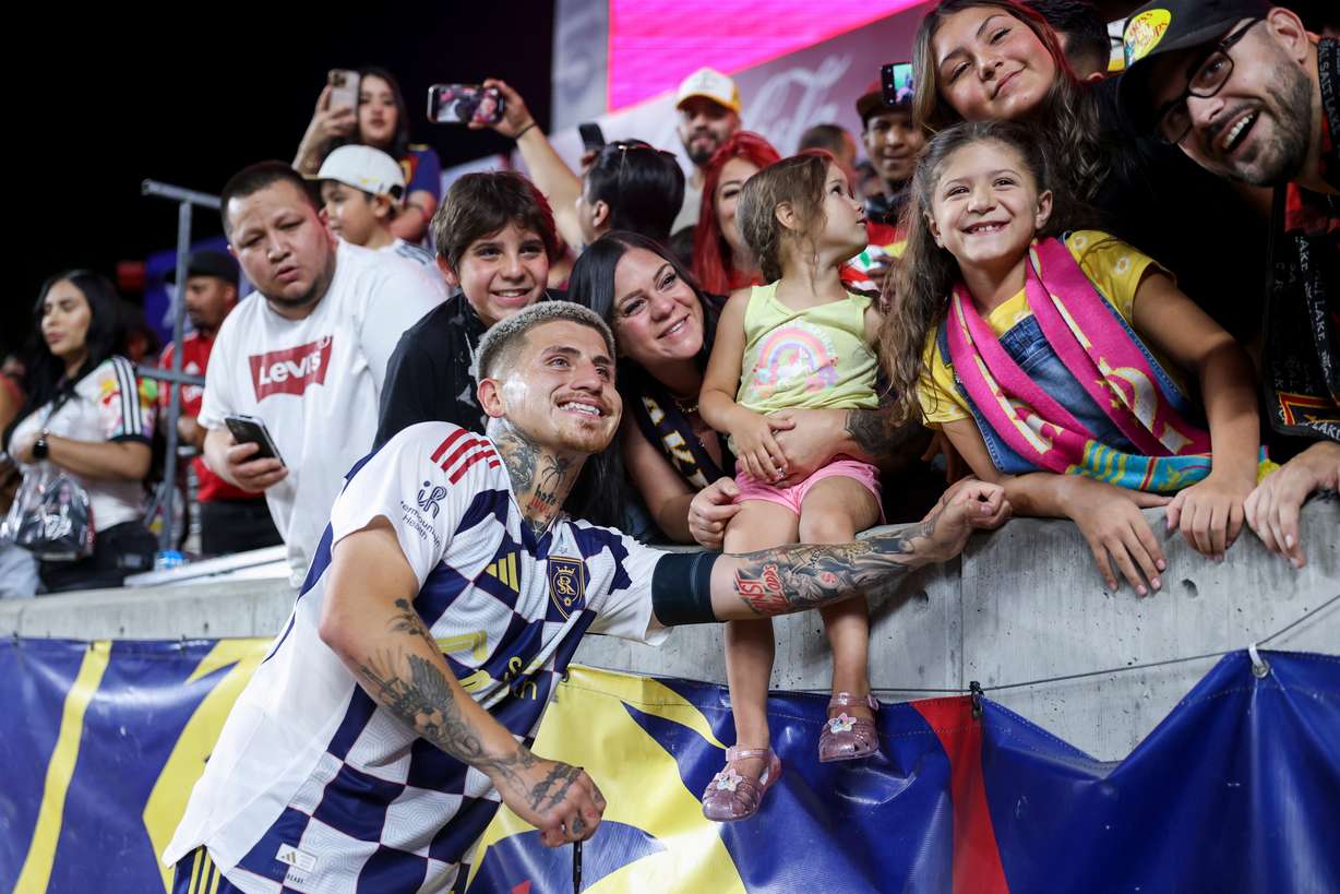 Real Salt Lake midfielder Diego Luna (8) takes photos with fans after the game against the Houston Dynamo at America First Field in Sandy on Saturday, July 12, 2025.