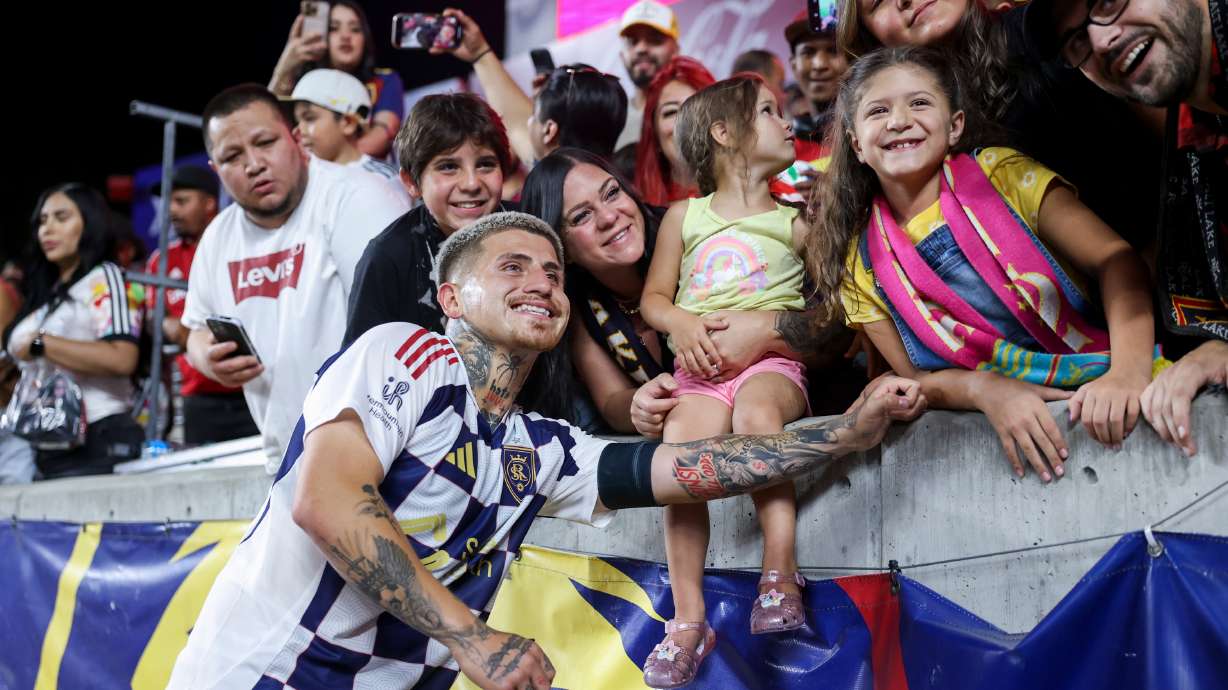 Real Salt Lake midfielder Diego Luna (8) takes photos with fans after the game against the Houston Dynamo at America First Field in Sandy on Saturday, July 12, 2025.