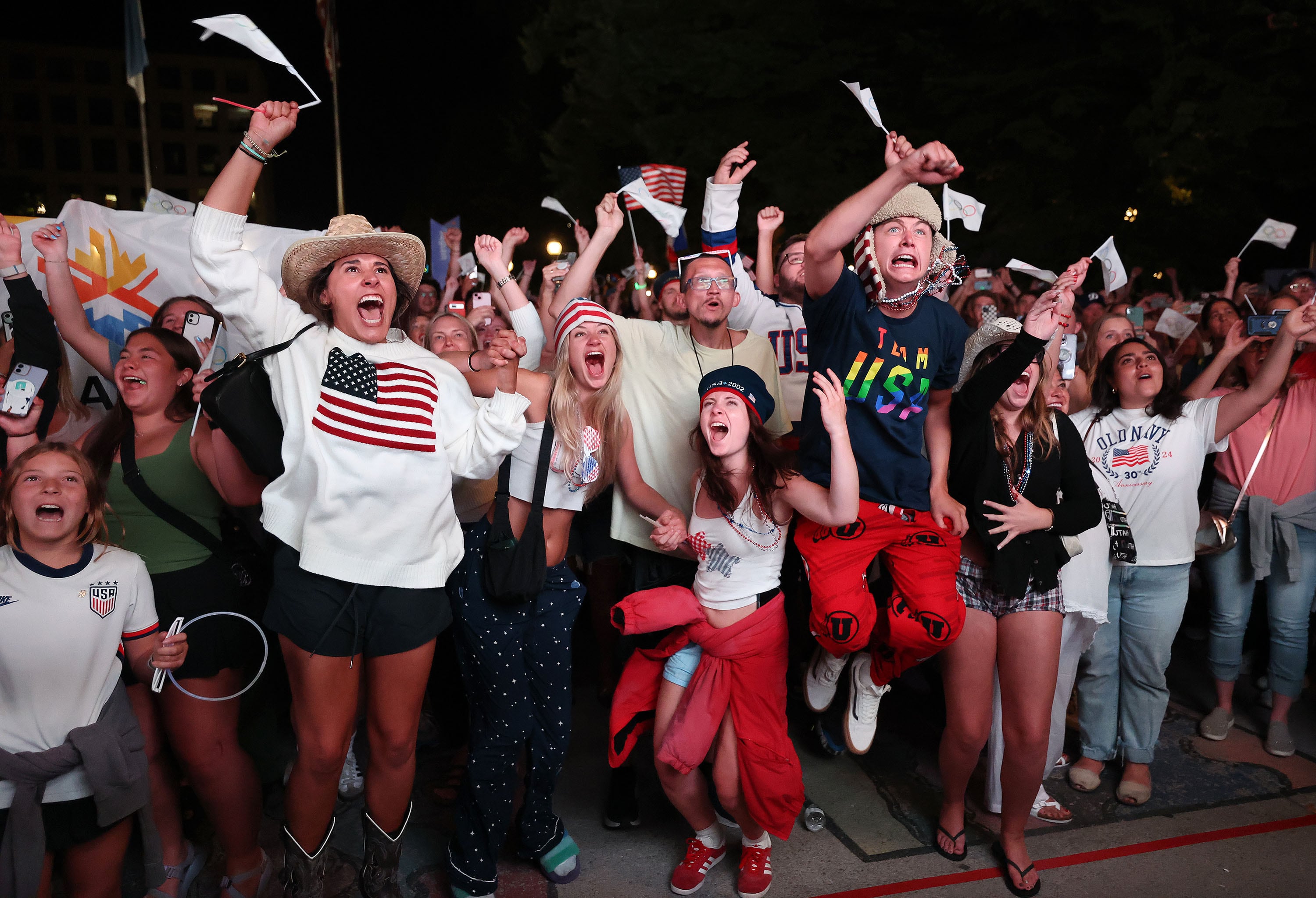 Attendees cheer after the International Olympic Committee awarded the 2034 Winter Olympic Games to the Salt Lake City-Utah Committee during a live watch party held at the Salt Lake City and County Building in Washington Square Park on July 24, 2024, in downtown Salt Lake City. Mayor Erin Mendenhall on Wednesday said the watch party was a "roll of the dice."