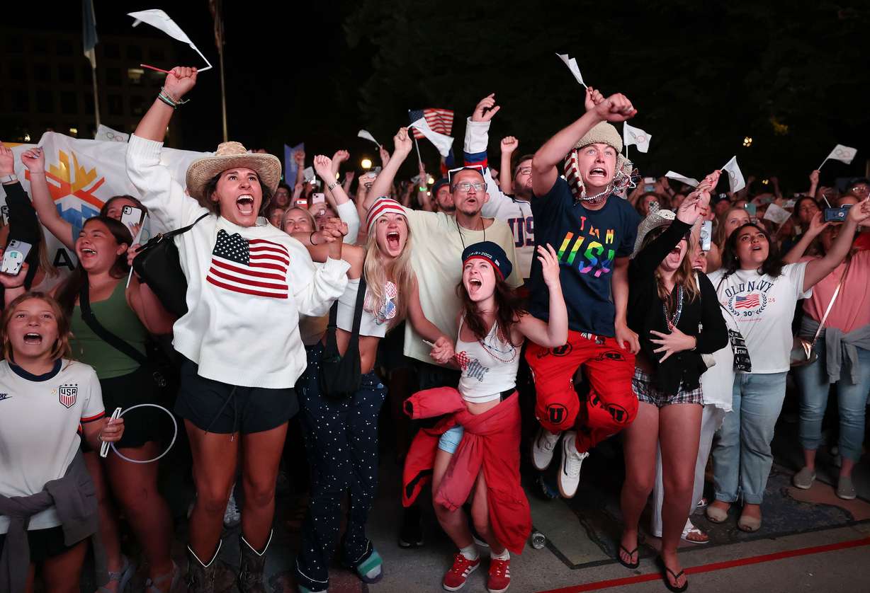 Attendees cheer after the International Olympic Committee awarded the 2034 Winter Olympic Games to the Salt Lake City-Utah Committee during a live watch party held at the Salt Lake City and County Building in Washington Square Park on July 24, 2024, in downtown Salt Lake City. Mayor Erin Mendenhall on Wednesday said the watch party was a "roll of the dice."