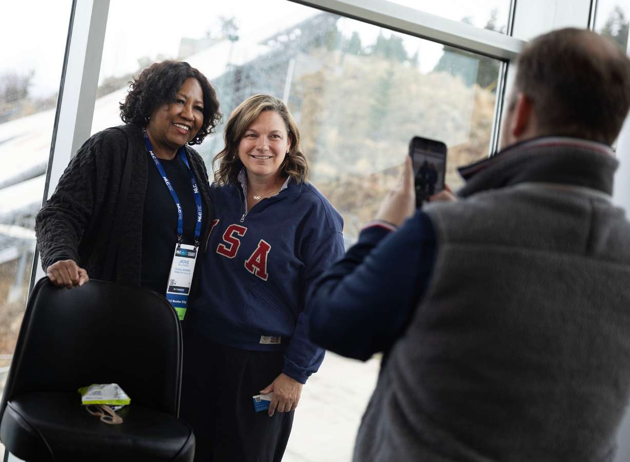Jackie Boleware, council member for Farmington Hills, Mich., gets her photo taken with Catherine Raney Norman, vice president of development and athlete relations for Salt Lake City-Utah 2034, following a National League of Cities panel discussion at the Utah Olympic Park in Park City on Wednesday. Raney Norman was part of a special panel discussion to help leaders understand how to learn from Utah's Olympic experience.