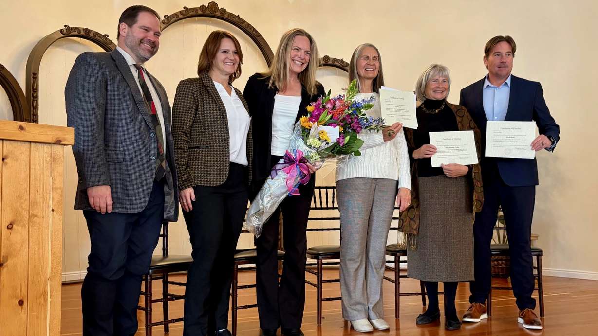 Three of the new leaders of the city taking shape in the Ogden Valley were sworn into office on Tuesday, Nov. 18, in Eden. They include Janet Wampler, the mayor-elect, holding flowers in the photo.