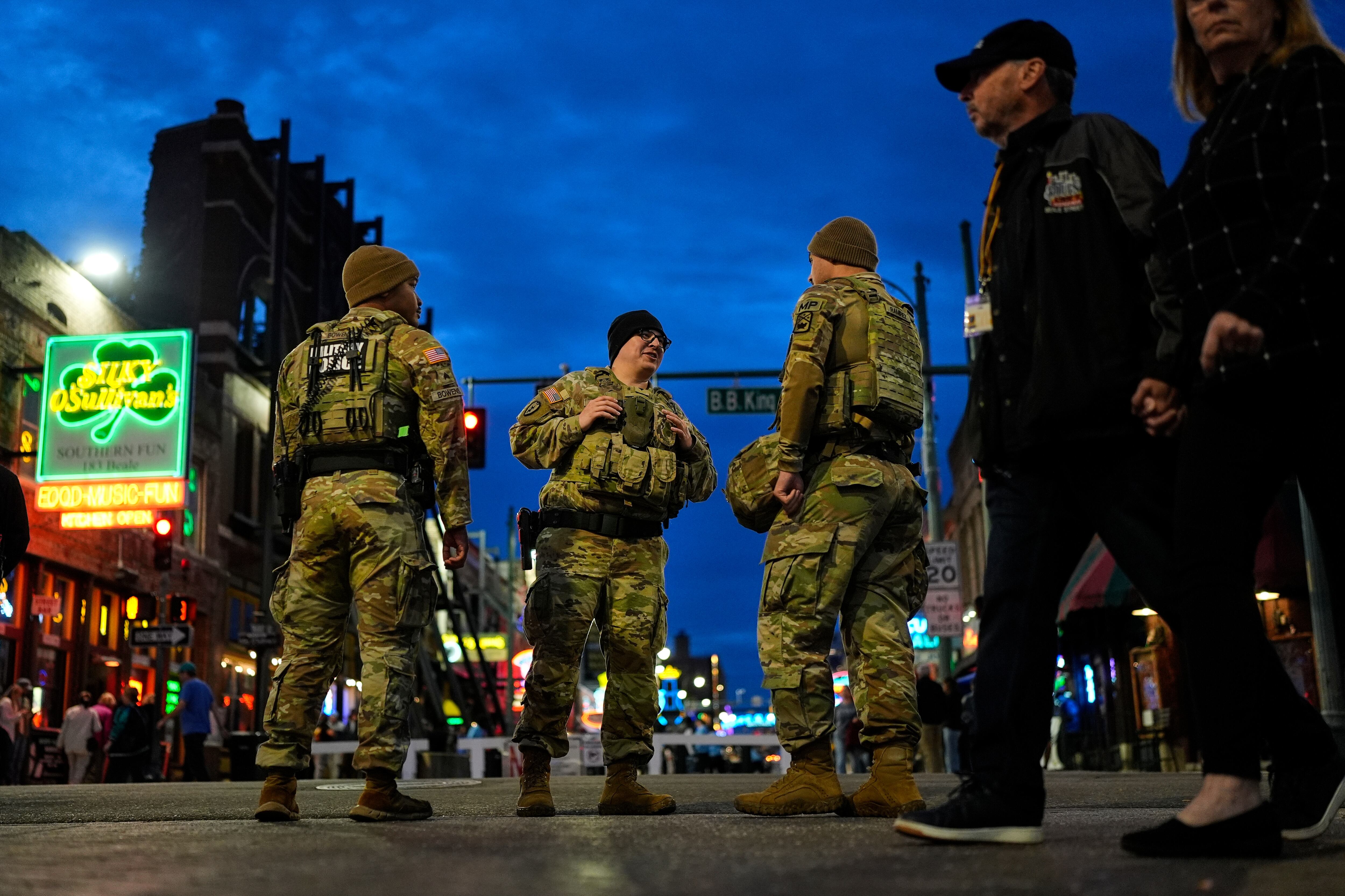 Members of the National Guard stand watch at the intersection of B.B. King Boulevard and Beale Street, Oct. 24 in Memphis, Tenn.