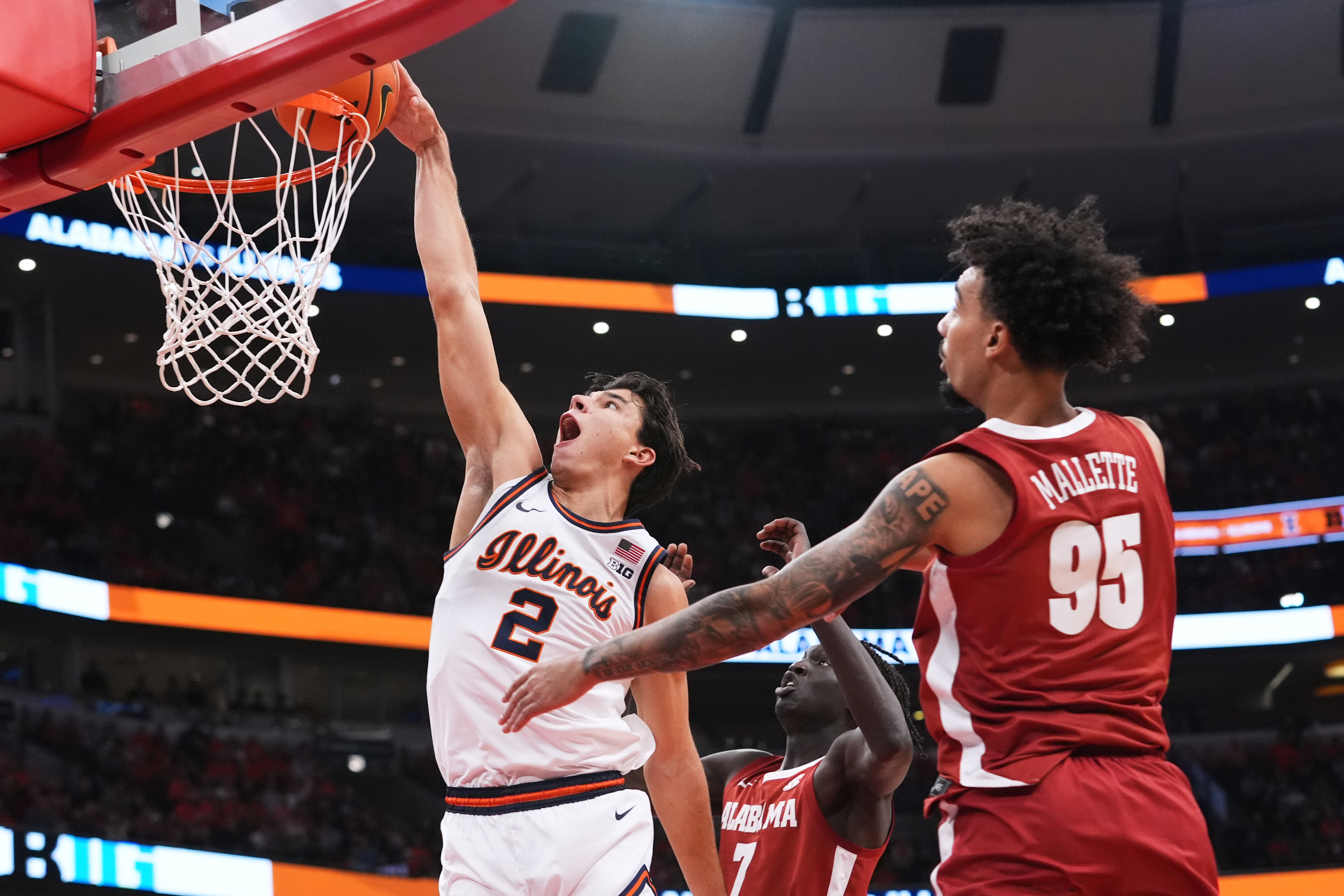 Illinois guard Andrej Stojakovic (2) dunks against Alabama during the first half of an NCAA college basketball game in Chicago, Wednesday, Nov. 19, 2025. 