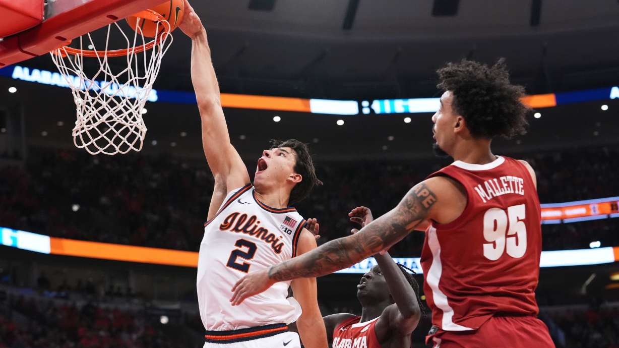 Illinois guard Andrej Stojakovic (2) dunks against Alabama during the first half of an NCAA college basketball game in Chicago, Wednesday, Nov. 19, 2025.