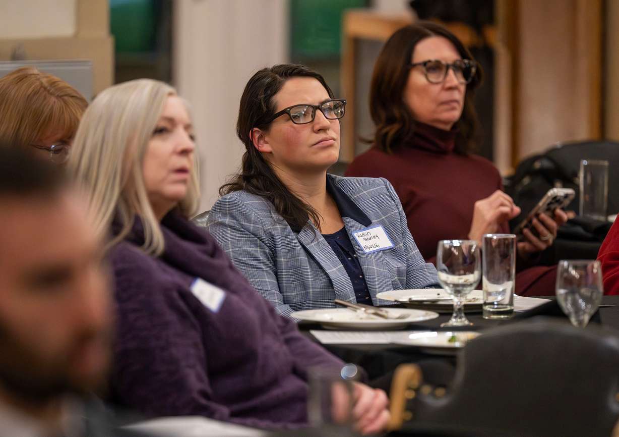 Kaelin Stanley and other audience members listen as Principles First holds a first-in-Utah dinner and discussion at the Clubhouse in Salt Lake City on Wednesday. Former presidential candidate John Kasich was one of the speakers.