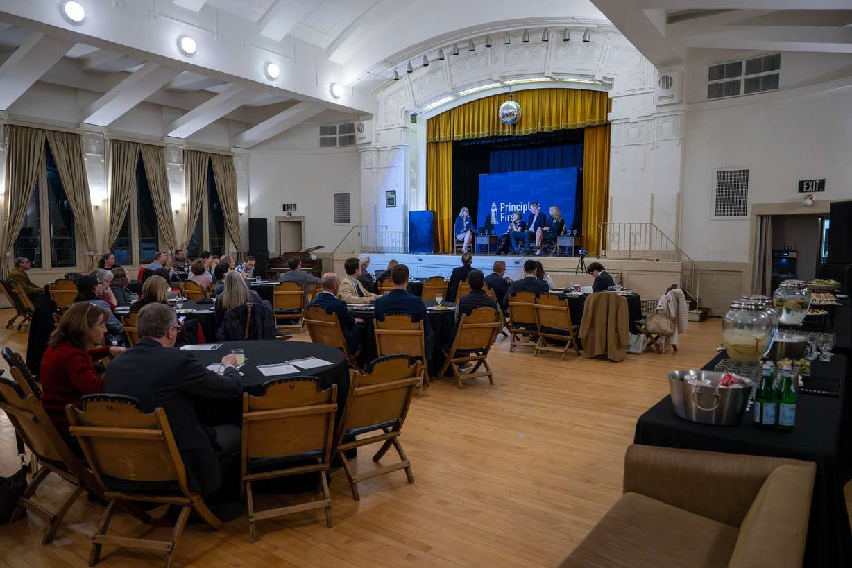 Emma Petty Addams, co-executive director of Mormon Women for Ethical Government, moderates a panel with former Congresswoman Claudine Schneider, former U.S. Senate candidate and BYU graduate Jared Young, and former CIA analyst and historian Holly Berkley Fletcher as Principles First holds a first-in-Utah dinner and discussion at the Clubhouse in Salt Lake City on Wednesday. Former presidential candidate John Kasich was also one of the speakers.