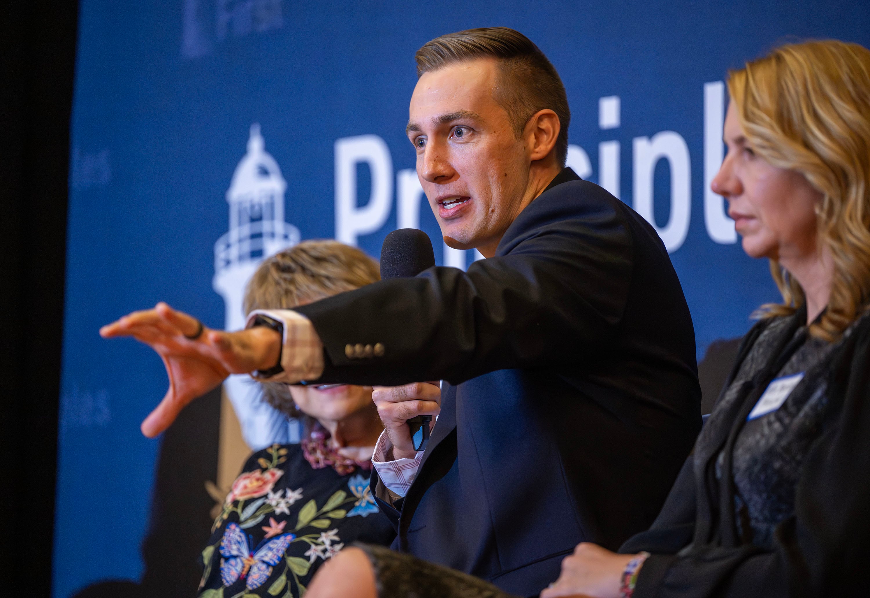 Former congresswoman Claudine Schneider, former U.S. Senate candidate and BYU graduate Jared Young, and former CIA analyst and historian Holly Berkley Fletcher participate in a panel discussion as Principles First holds a first-in-Utah dinner and discussion at the Clubhouse in Salt Lake City on Wednesday. Former presidential candidate John Kasich was also one of the speakers.