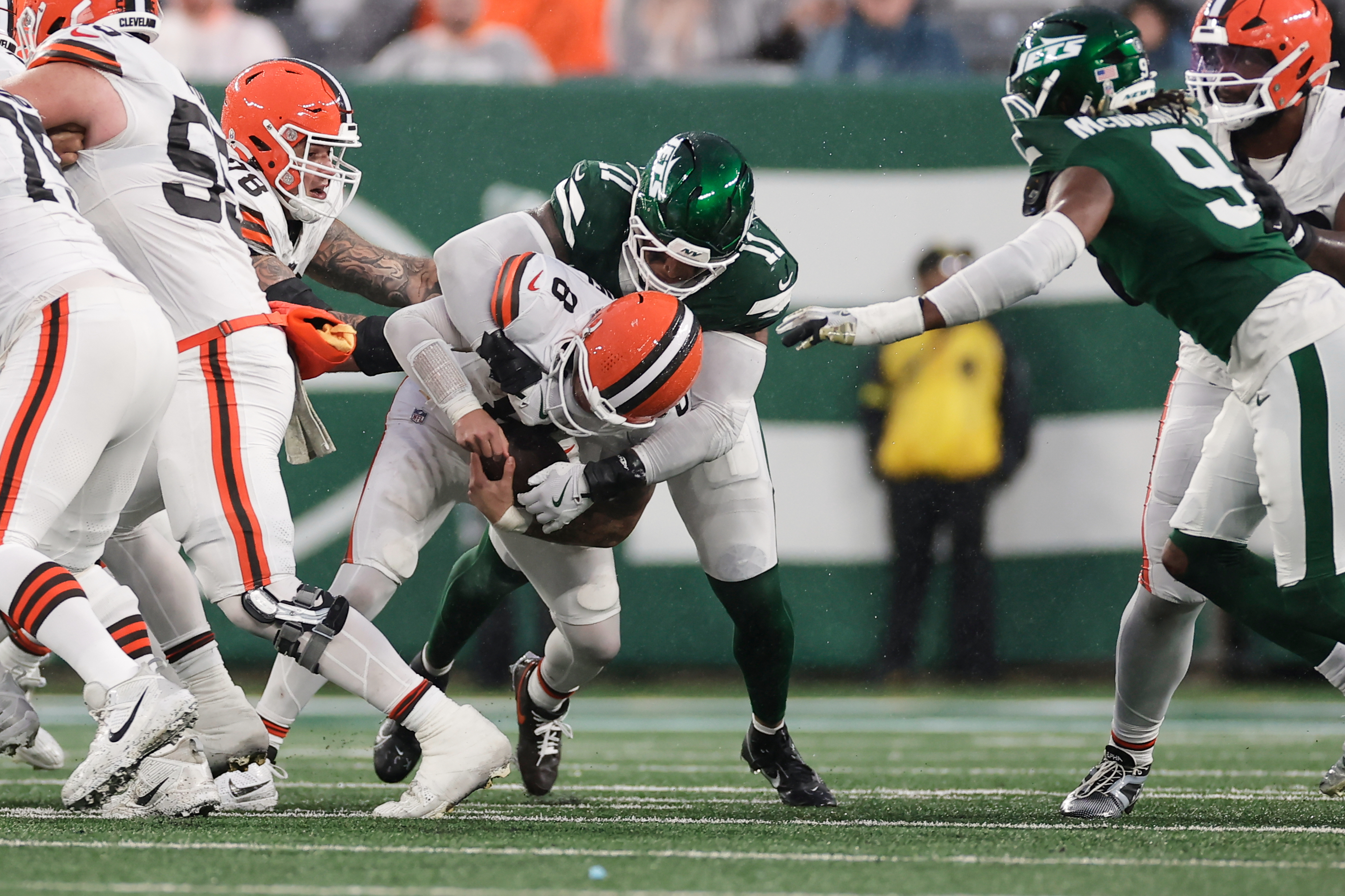 Cleveland Browns quarterback Dillon Gabriel (8) is sacked by New York Jets linebacker Jermaine Johnson (11) in the second half of an NFL football game, Sunday, Nov. 9, 2025, in East Rutherford, N.J. 