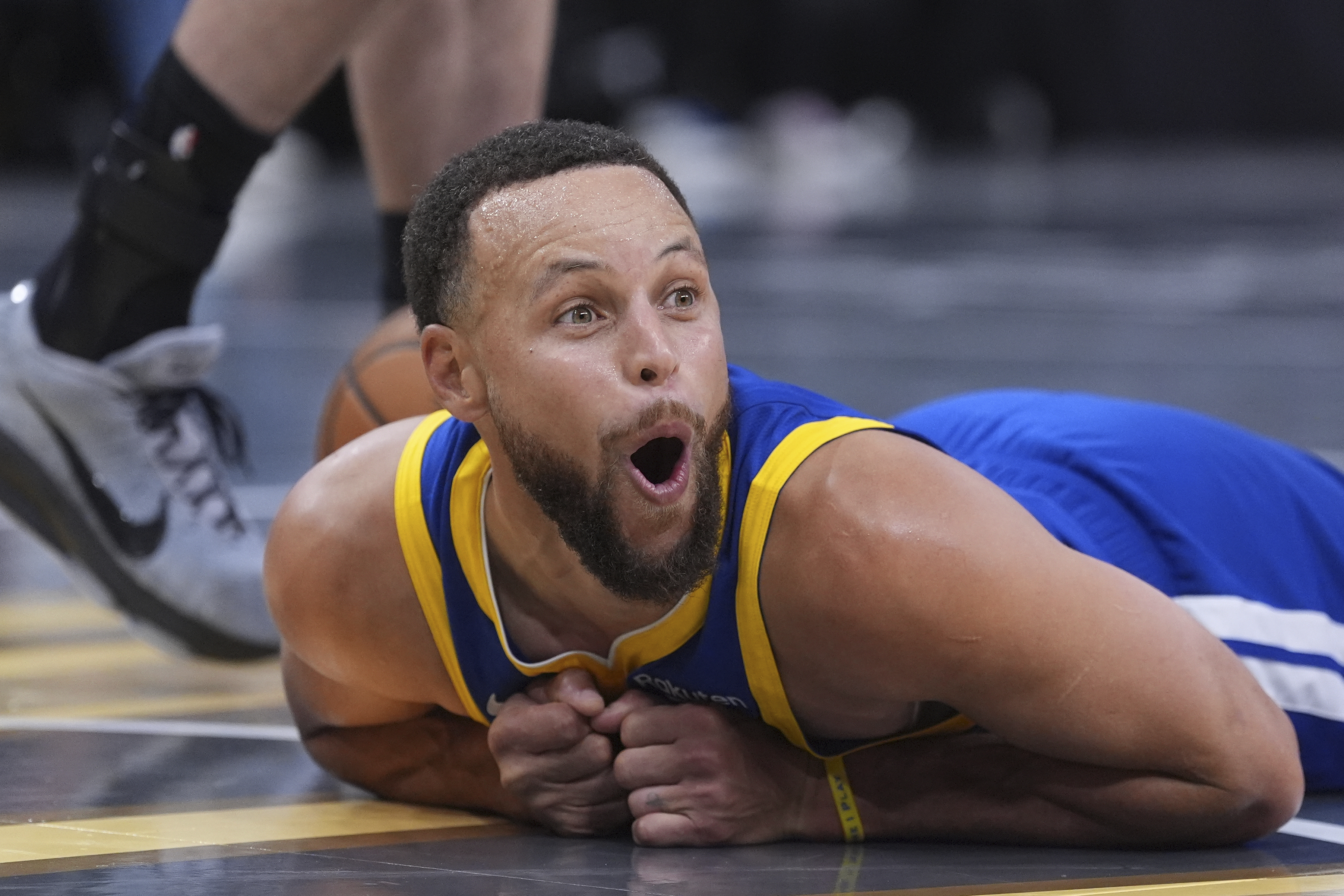 Golden State Warriors guard Stephen Curry (30) reacts after he was fouled during the second half of an NBA Cup basketball game against the San Antonio Spurs in San Antonio, Friday, Nov. 14, 2025.