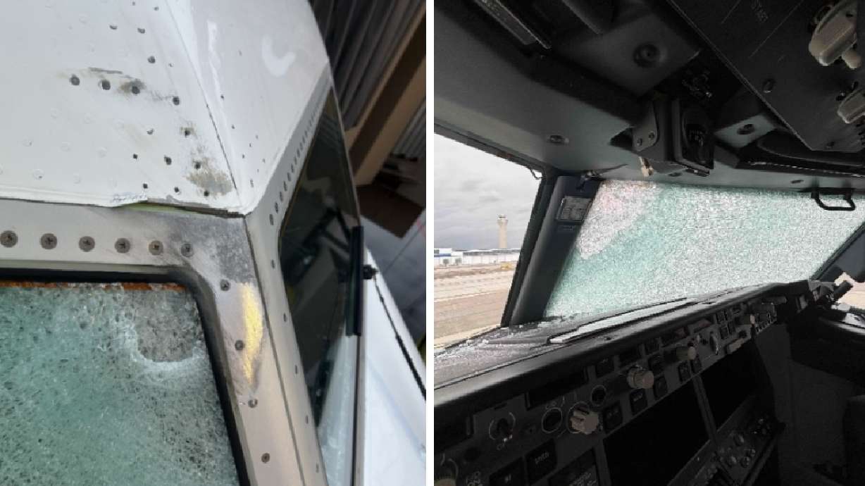 The damaged front windshield of a United Airlines flight that made an emergency landing in Salt Lake City on Oct. 16. A report released Thursday says a midair collision with a weather balloon over the Moab area likely caused damage.