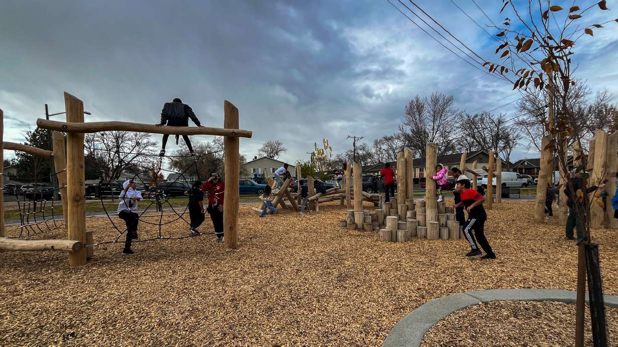 Backman Elementary School students play on the playground at Backman Community Open Space in Salt Lake City on Thursday. The new park is the first completed project from a bond city residents approved in 2022.