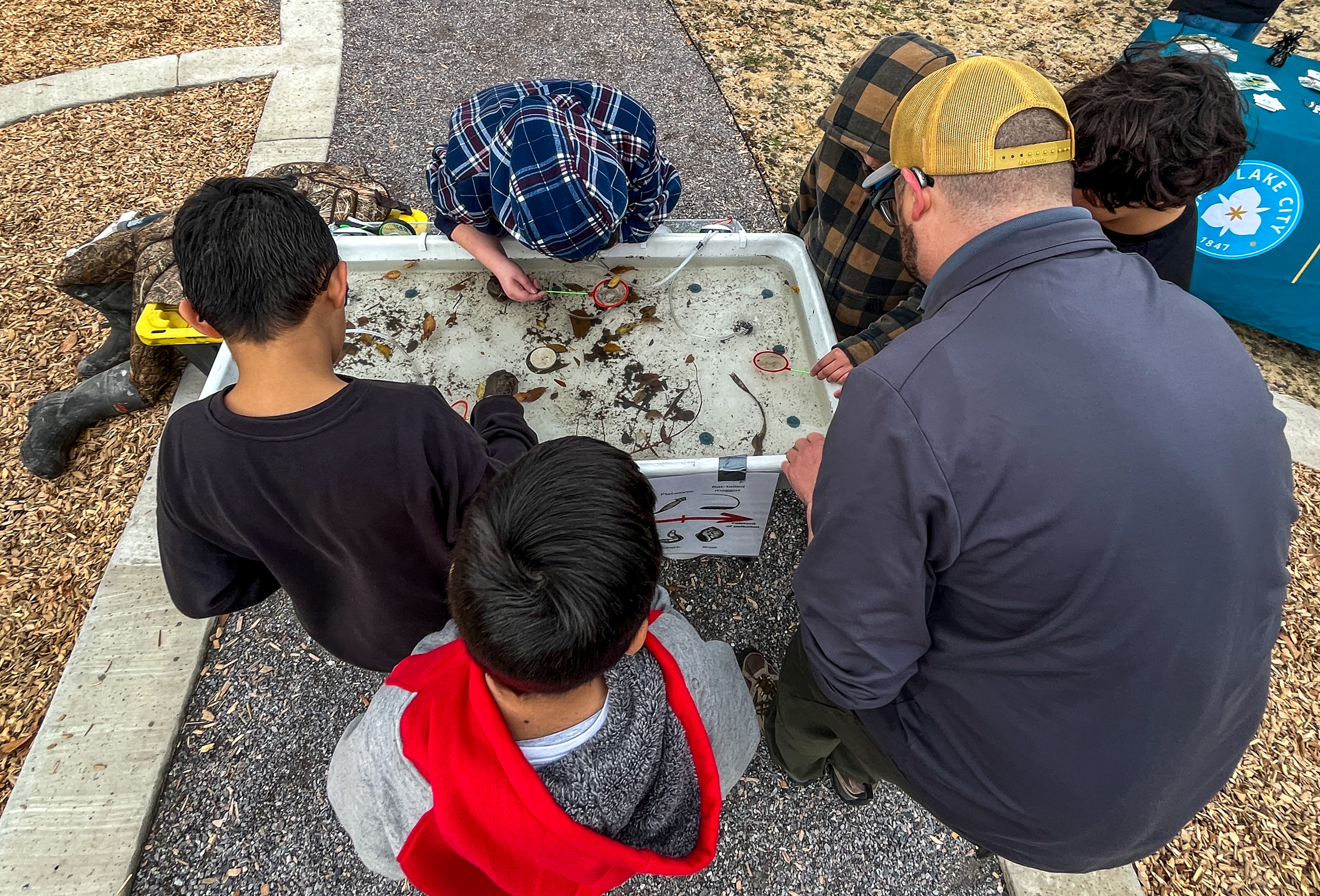 Backman Elementary School students learn about the Jordan River's ecosystem at a science station set up at Backman Community Open Space in Salt Lake City on Thursday.