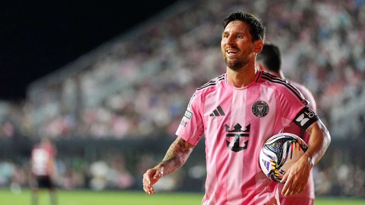 Inter Miami forward Lionel Messi carries the ball on his way to take a corner kick, during the second half of a Leagues Cup group stage soccer match against Atlas, July 30, in Fort Lauderdale, Fla.