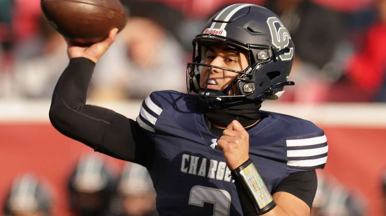 Corner Canyon’s quarterback Helaman Casuga passes during the 6A football state championship game against Lone Peak at Rice-Eccles Stadium in Salt Lake City on Thursday, Nov. 20, 2025.
