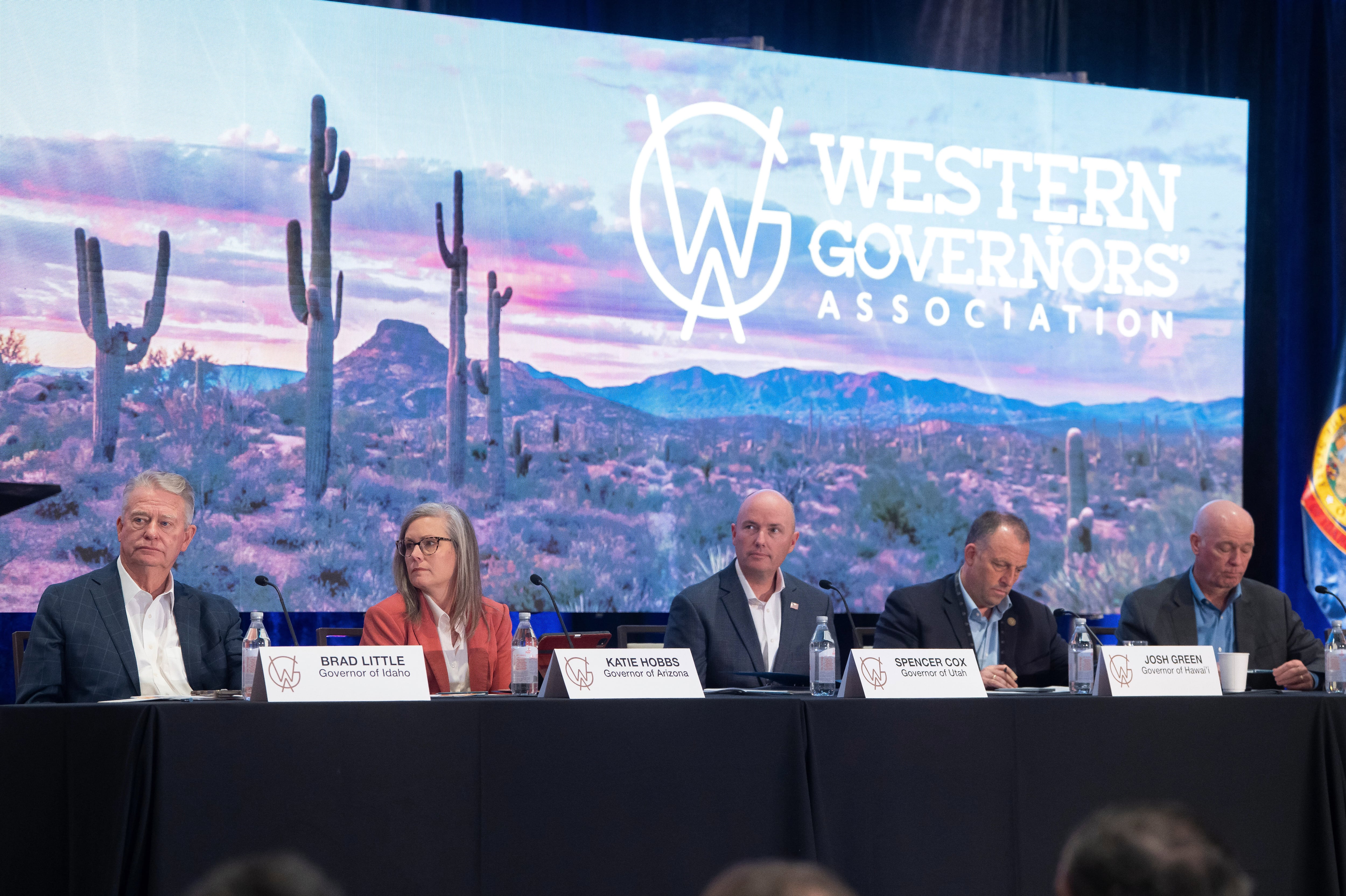 From left, Idaho Gov. Brad Little, Arizona Gov. Katie Hobbs, Utah Gov. Spencer Cox, Hawaii Gov. Josh Green and Montana Gov. Greg Gianforte listen during the Western Governors' Association meeting Thursday, in Scottsdale, Ariz.