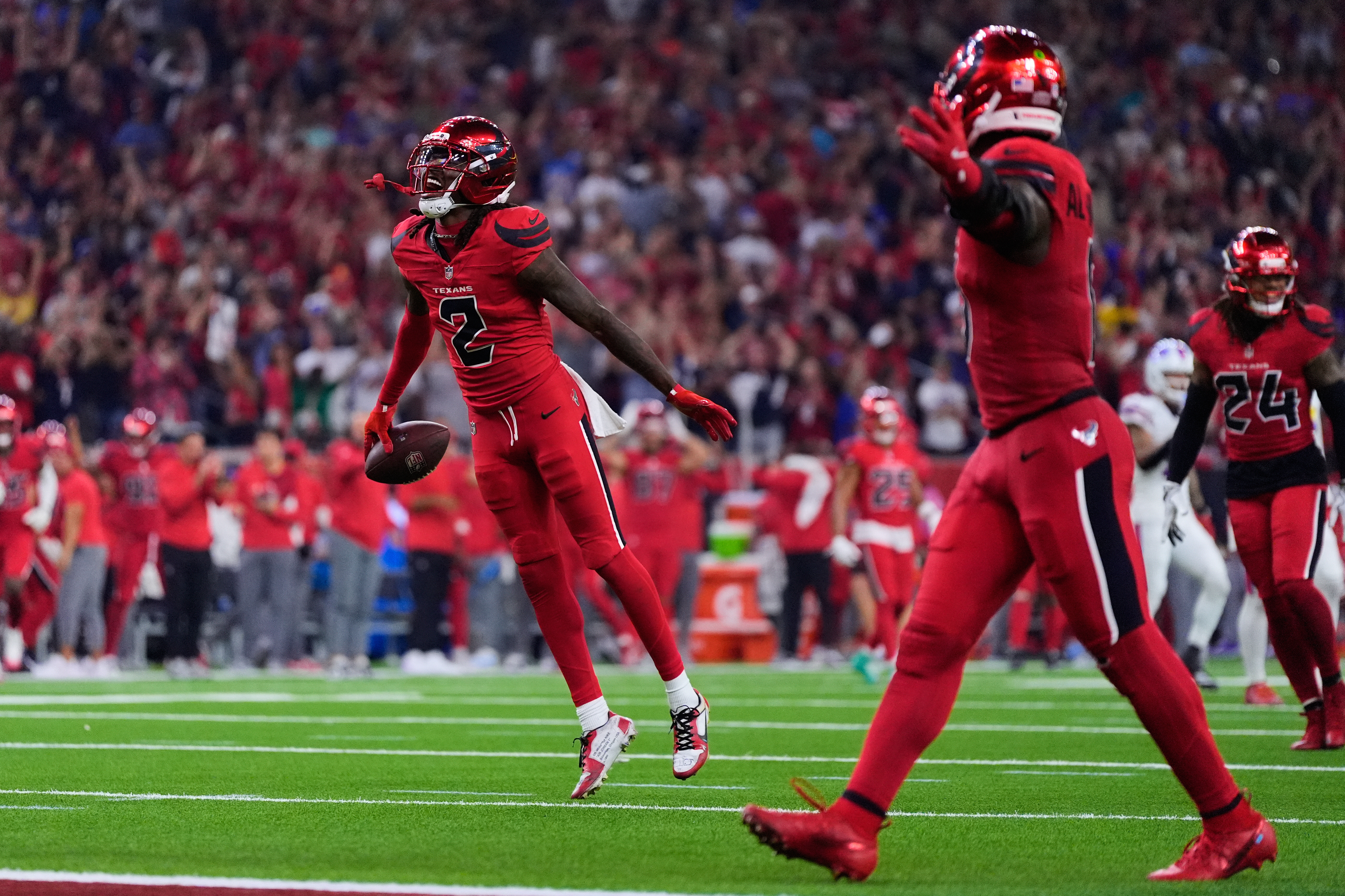 Houston Texans safety Calen Bullock (2) celebrates after intercepting a Buffalo Bills' Josh Allen pass in the second half of an NFL football game Thursday, Nov. 20, 2025, in Houston.
