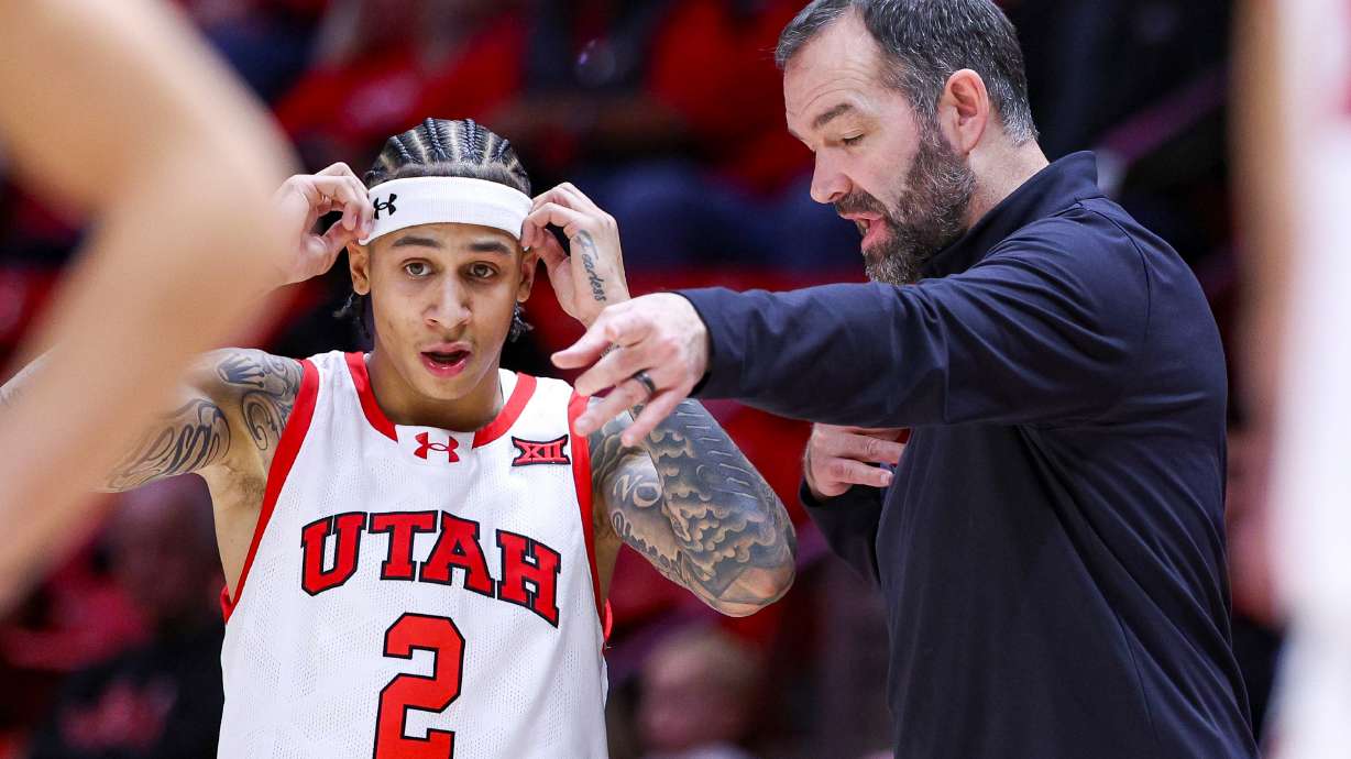 Utah guard Terrence Brown (2) talks with head coach Alex Jensen during an NCAA men’s basketball game against the Cal Poly Mustangs held at the Huntsman Center in Salt Lake City on Thursday, Nov. 20, 2025.