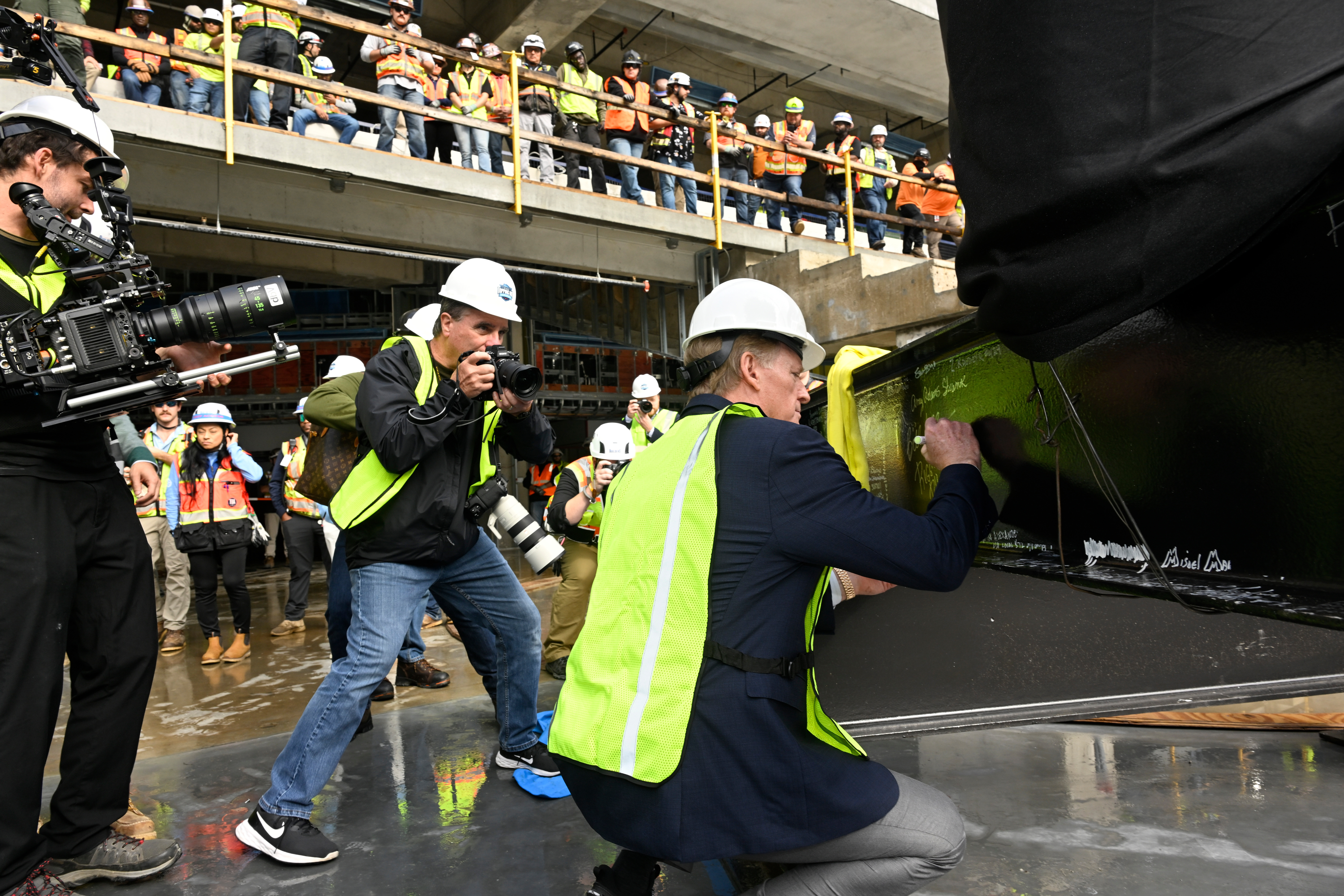 NFL Commissioner Roger Goodell signs a beam during a topping out ceremony to celebrate the ongoing construction of the Tennessee Titans NFL football new stadium, Friday, Nov. 21, 2025, in Nashville, Tenn. 