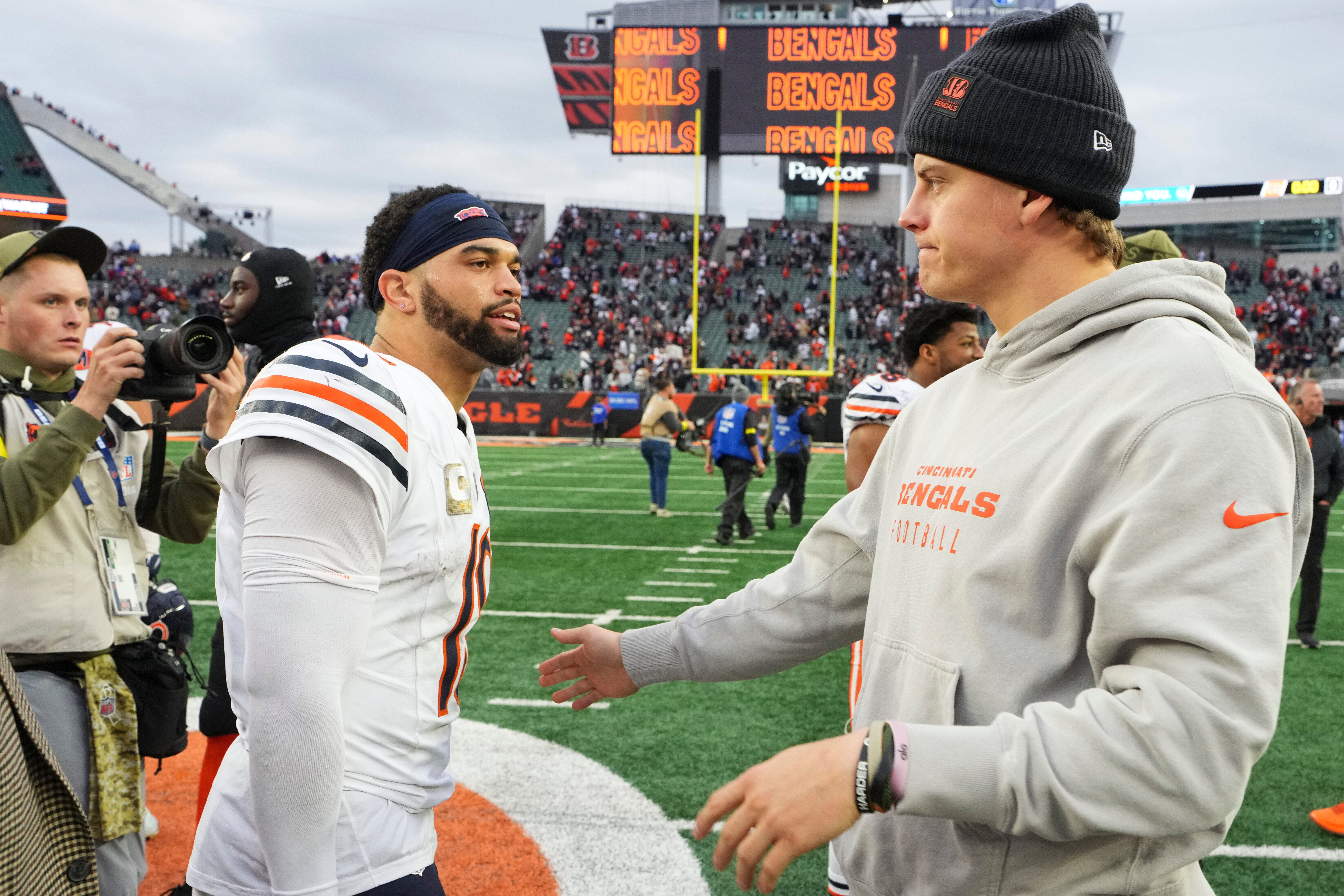 Cincinnati Bengals quarterback Joe Burrow (9), right, greets Chicago Bears quarterback Caleb Williams (18) after an NFL football game, Sunday, Nov. 2, 2025, in Cincinnati. 
