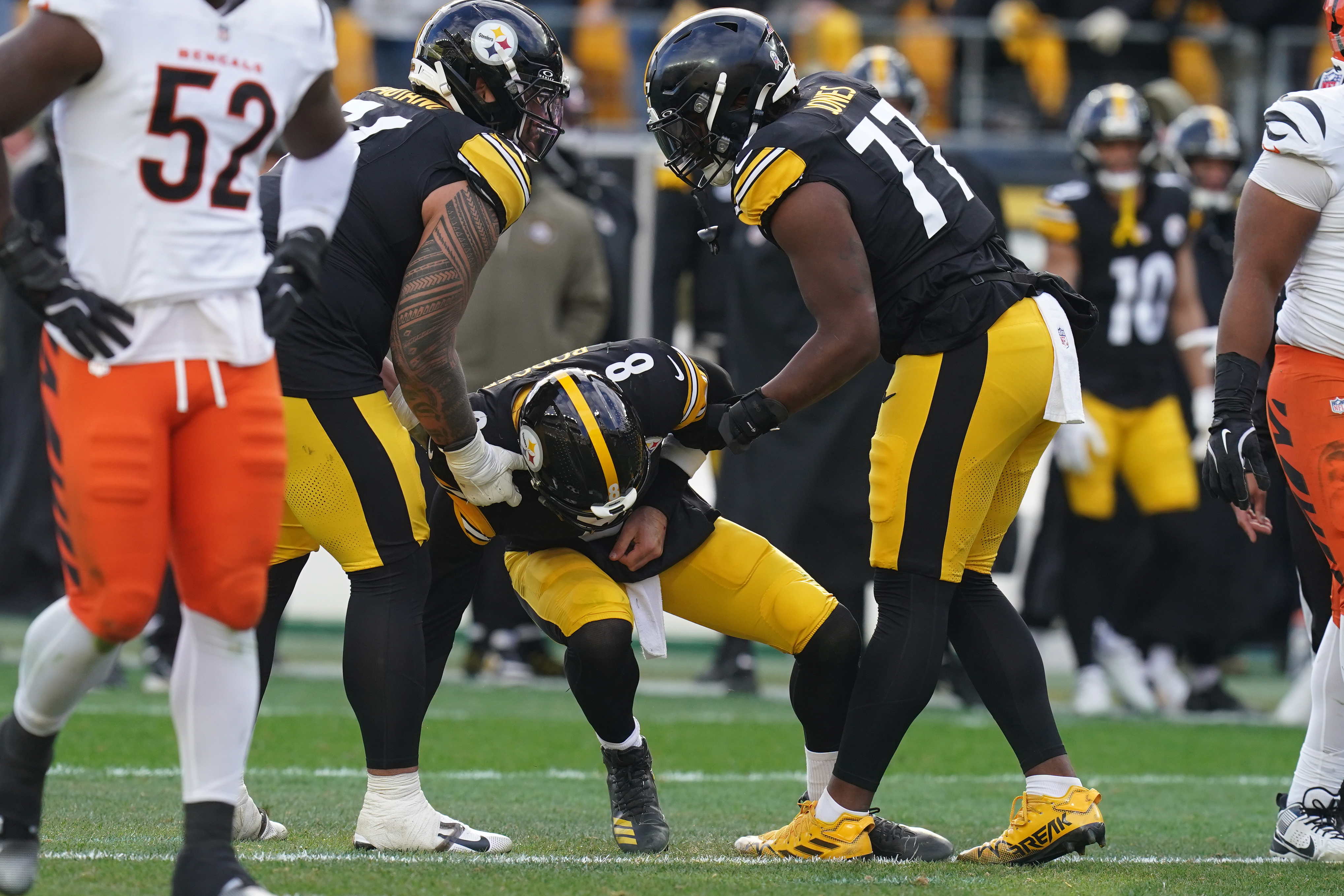 Pittsburgh Steelers quarterback Aaron Rodgers (8) is helped up off the field after a hit by the Cincinnati Bengals during the first half of an NFL football game Sunday, Nov. 16, 2025, in Pittsburgh. 
