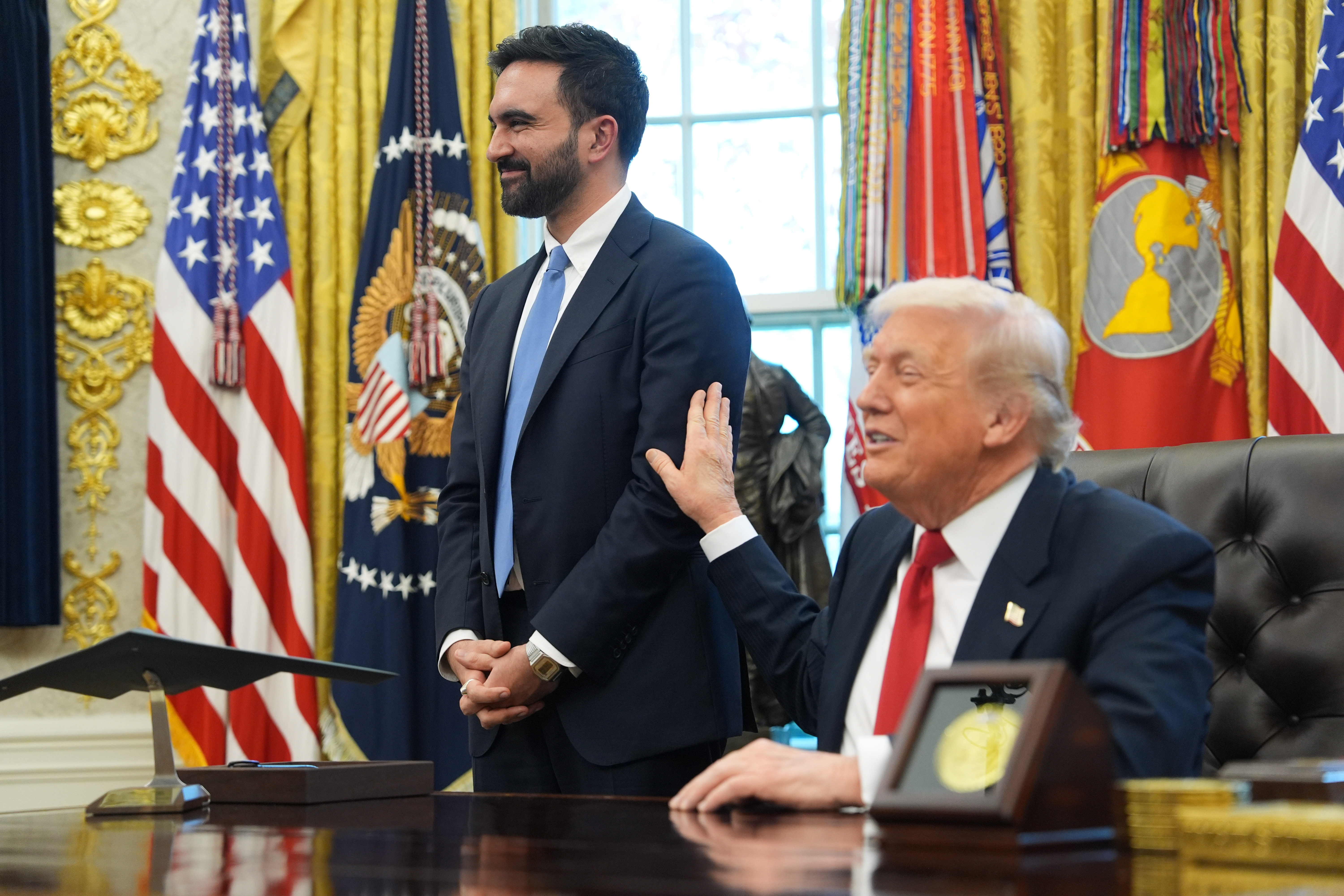 President Donald Trump talks after meeting with New York City Mayor-elect Zohran Mamdani in the Oval Office of the White House, Friday, in Washington. Despite the two men trading barbs earlier, Trump praised Mamdani, saying, "The better he does, the happier I am."