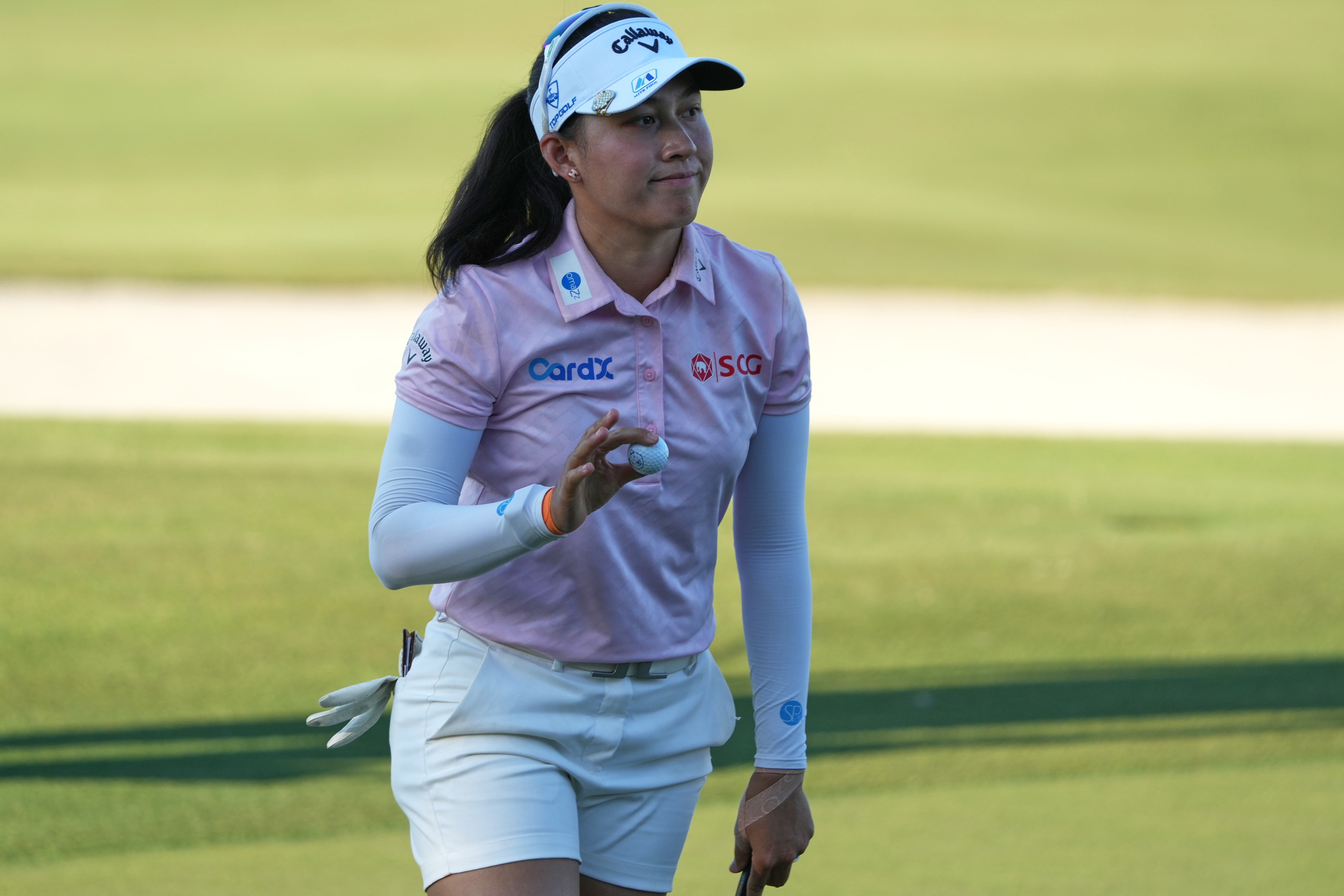 Jeeno Thitikul of Thailand shows her ball after making a birdie putt on the 17th hole during the second round of the LPGA Tour Championship golf tournament, Friday, Nov. 21, 2025, in Naples, Fla.