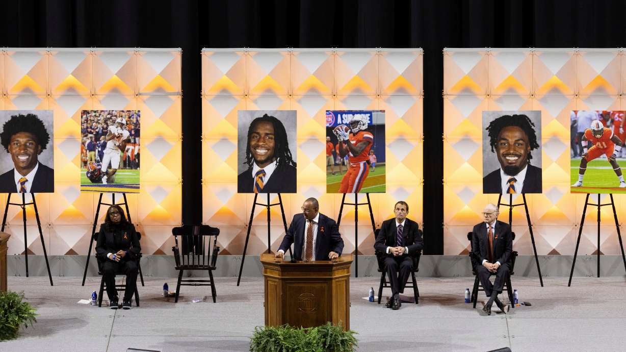 FILE - University of Virginia head football coach Tony Elliott speaks at a memorial service for three football players that were fatally shot, in Charlottesville, Va., Nov. 19, 2022.