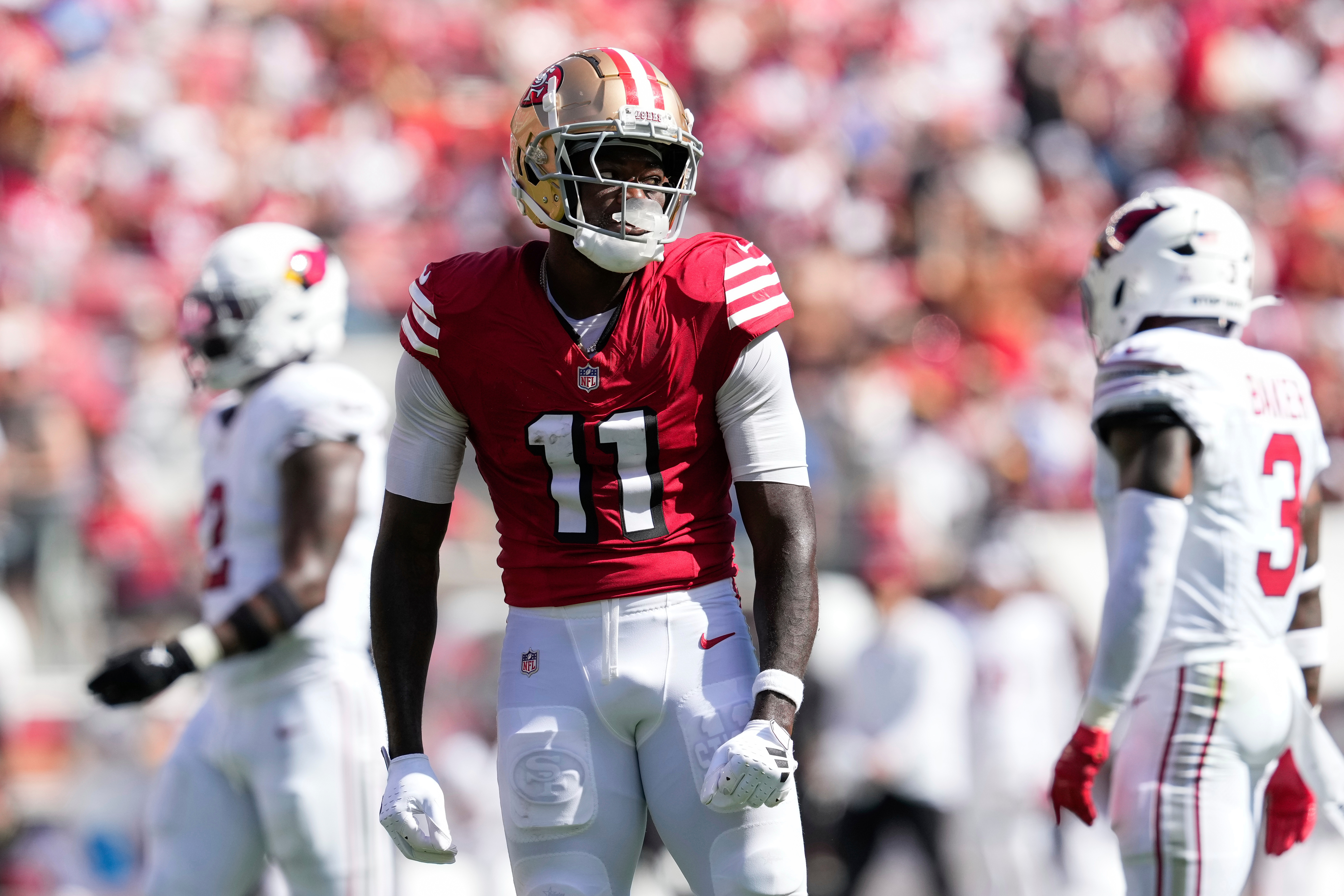 FILE - San Francisco 49ers wide receiver Brandon Aiyuk (11) reacts during the first half of an NFL football game against the Arizona Cardinals, Oct. 6, 2024, in Santa Clara, Calif. 