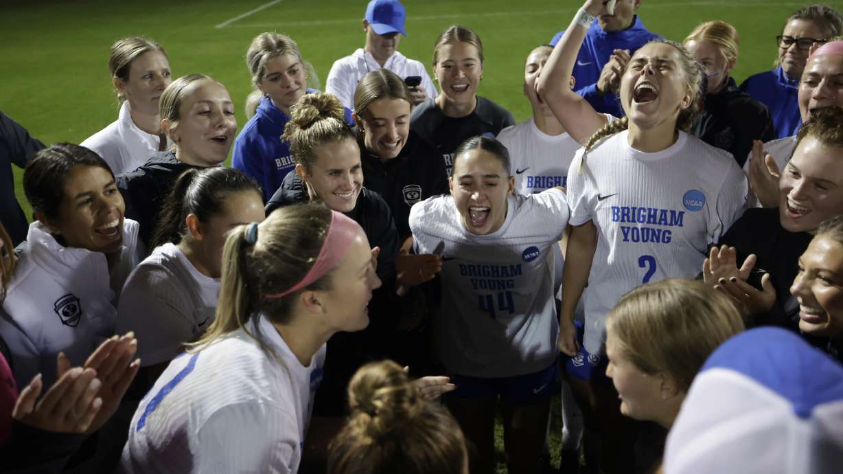 BYU women's soccer celebrates after eliminating UCLA 4-2 on penalty kicks to advance to the Round of 16 of the NCAA women's soccer tournament following a 1-1 draw with the Bruins, Friday, Nov. 21, 2025 in Stanford, California.