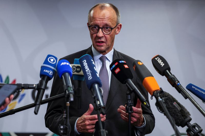 Germany's Chancellor Friedrich Merz speaks to the media, on the opening day of the G20 Leaders’ Summit at the Nasrec Expo Center in Johannesburg, South Africa, Saturday. Merz said a potential collapse of Ukraine would have an effect politically on the entire European continent.
