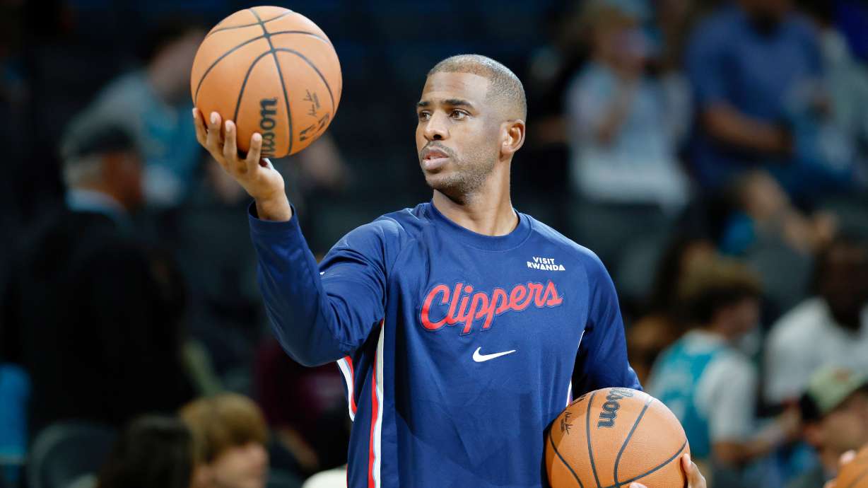 Los Angeles Clippers guard Chris Paul warms up before of an NBA basketball game against the Charlotte Hornets in Charlotte, N.C., Saturday, Nov. 22, 2025.