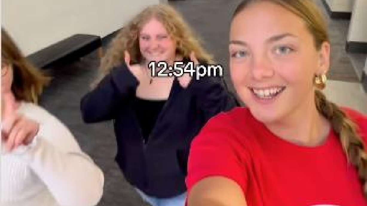 Lindsey Wessling walks with friends, during a marathon around a building at the Southern Utah University campus.