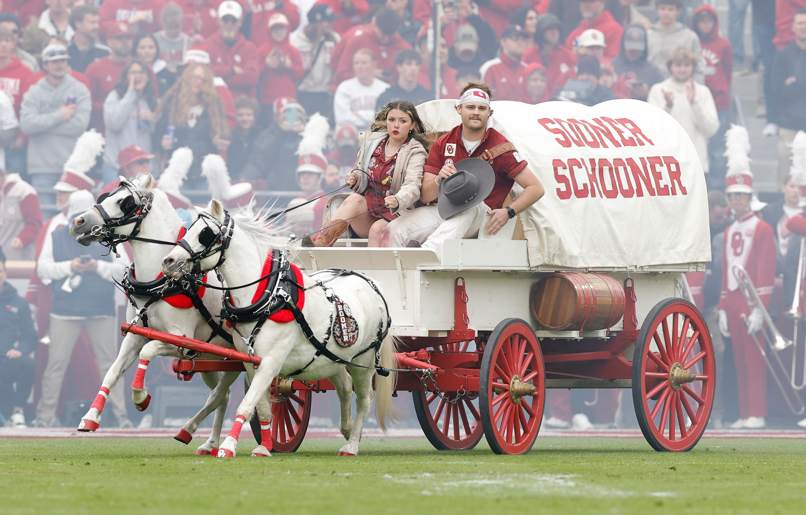 Members of the Oklahoma spirit groups drive the Sooner Schooner after a touchdown against Missouri during the first half of an NCAA college football game Saturday, Nov. 22, 2025, in Norman, Okla. 