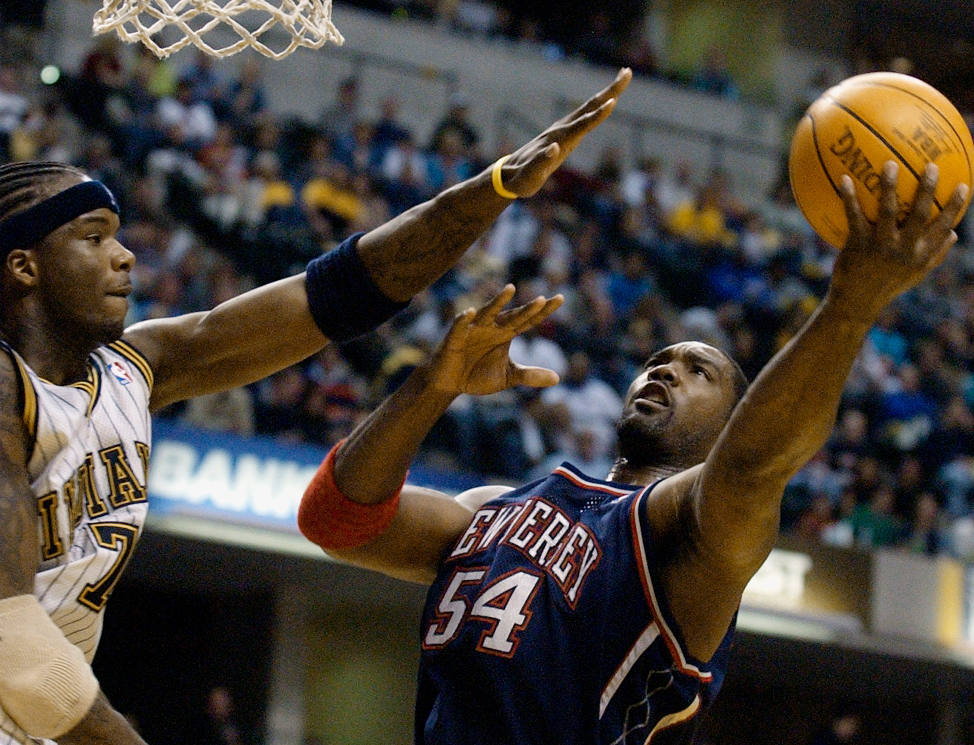 FILE - New Jersey Nets forward Rodney Rogers puts up a shot against Indiana Pacers forward Jermaine O'Neal during the first quarter of a basketball game in Indianapolis, April 9, 2004. 